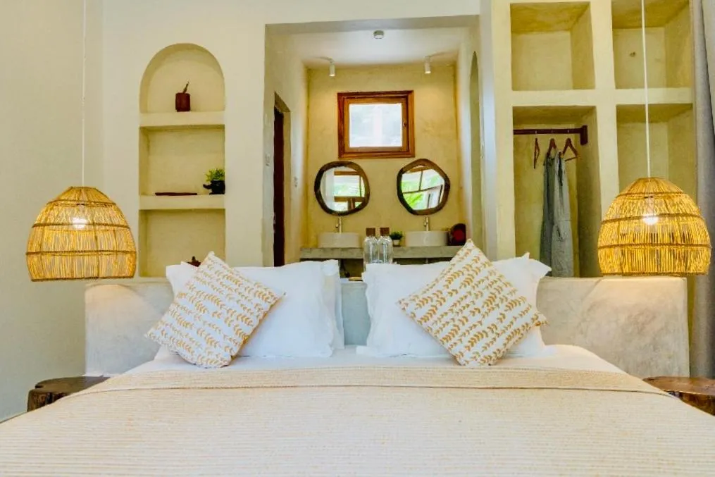 Bed in Mnana Beach Bungalows