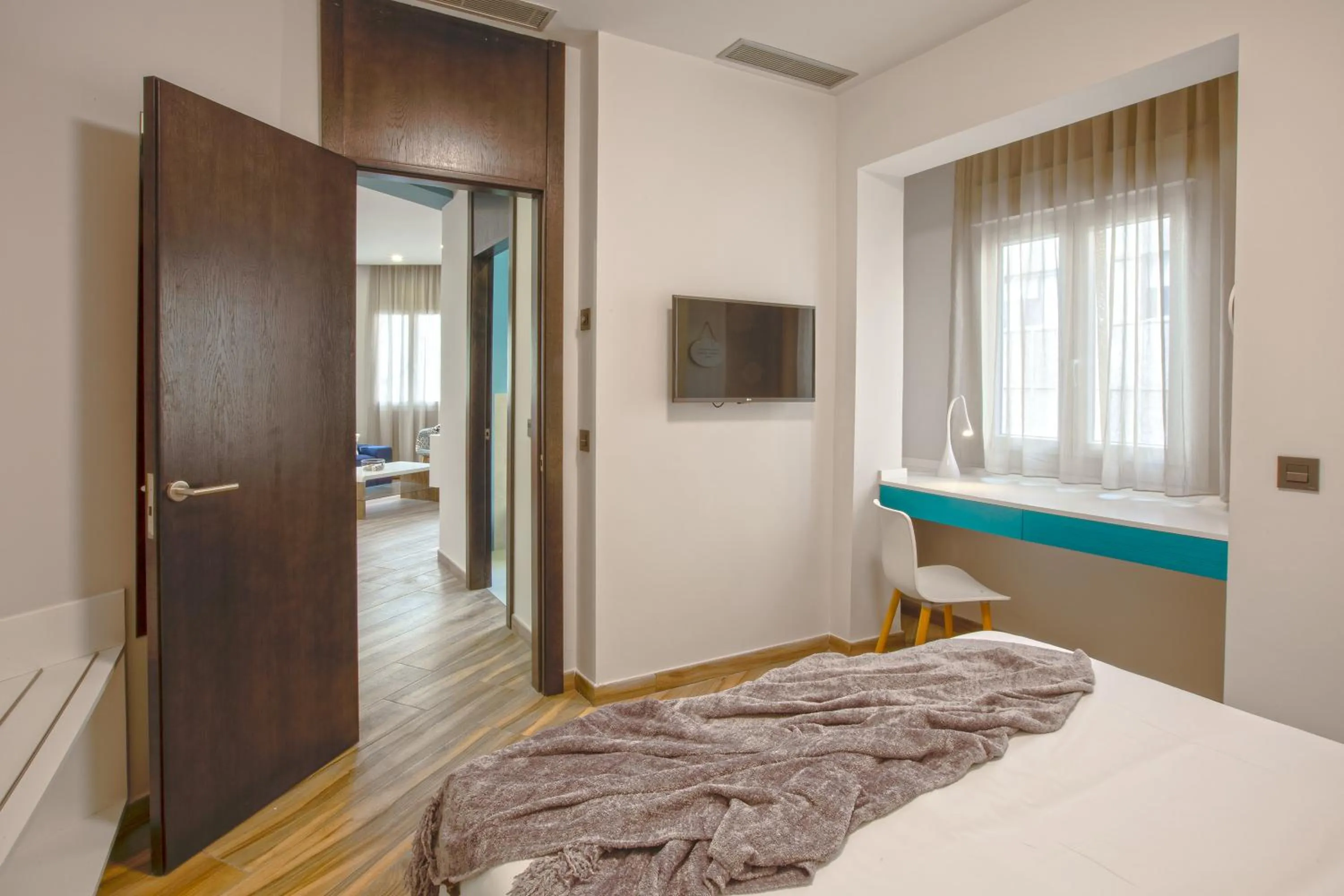 Bed in Gran Marina Suites