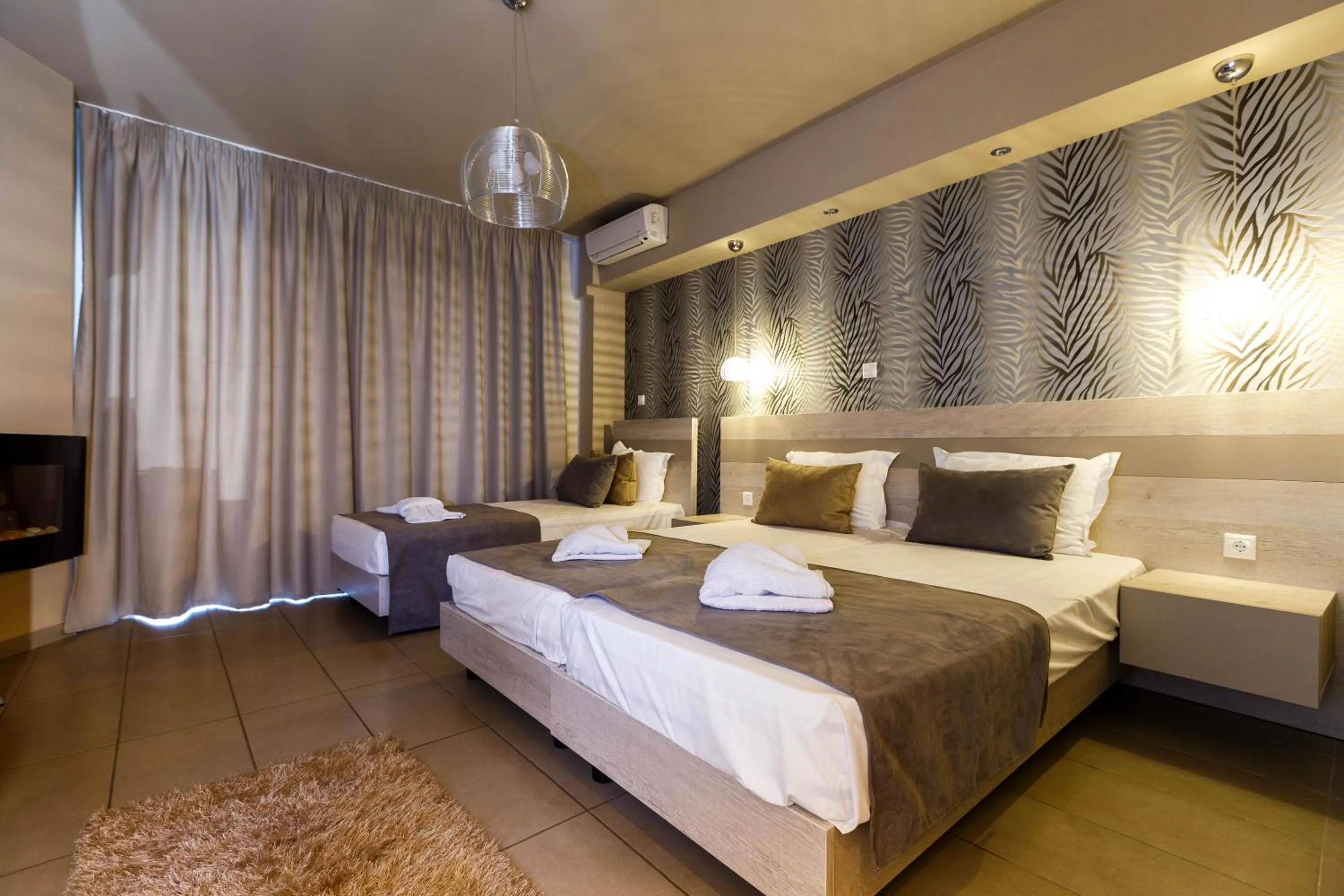 Bed in Limani Comfort Rooms