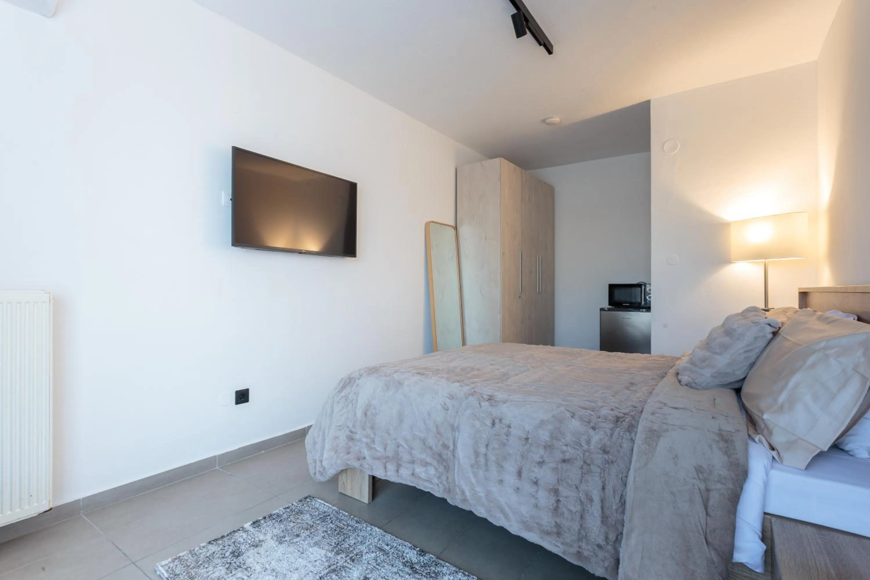 Bed in Limani Comfort Rooms