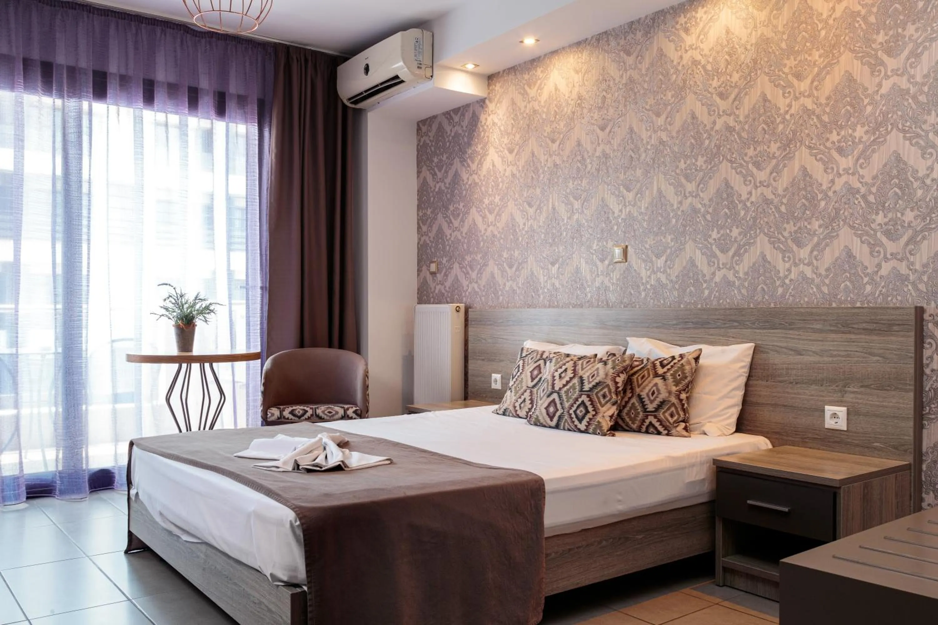 Bed in Limani Comfort Rooms