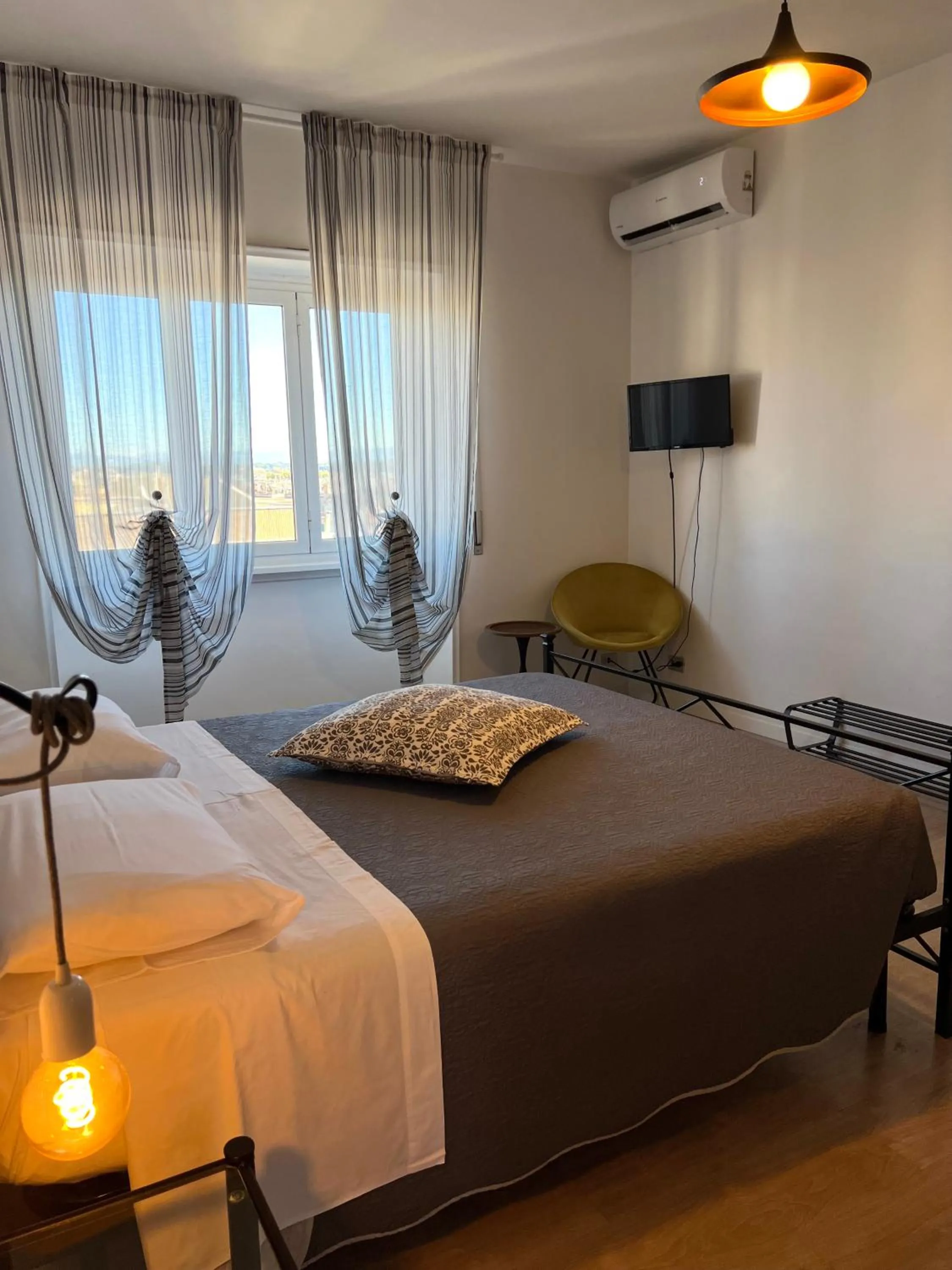 Bed in Eufonia Vinyl Friendly Apartment