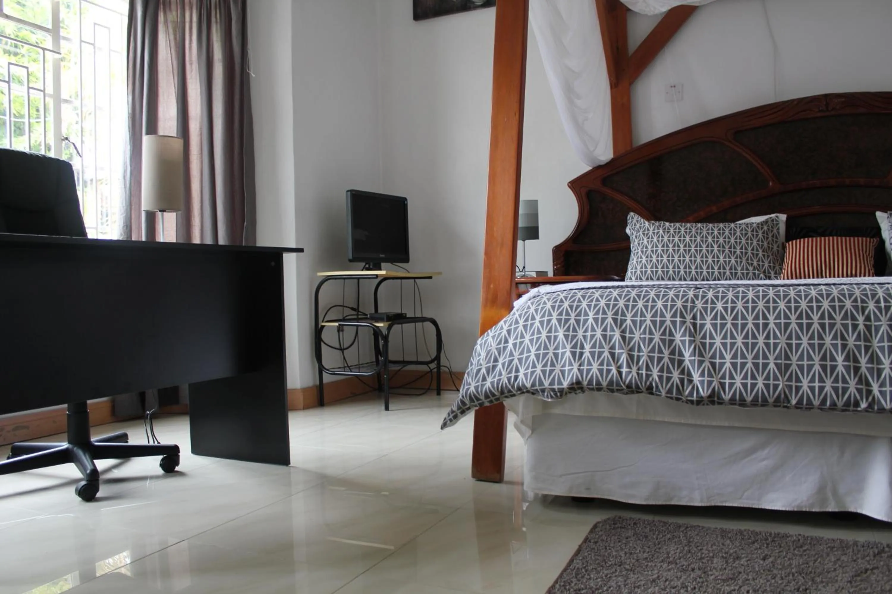 Bed in Blue Lagoon Lodge Blantyre