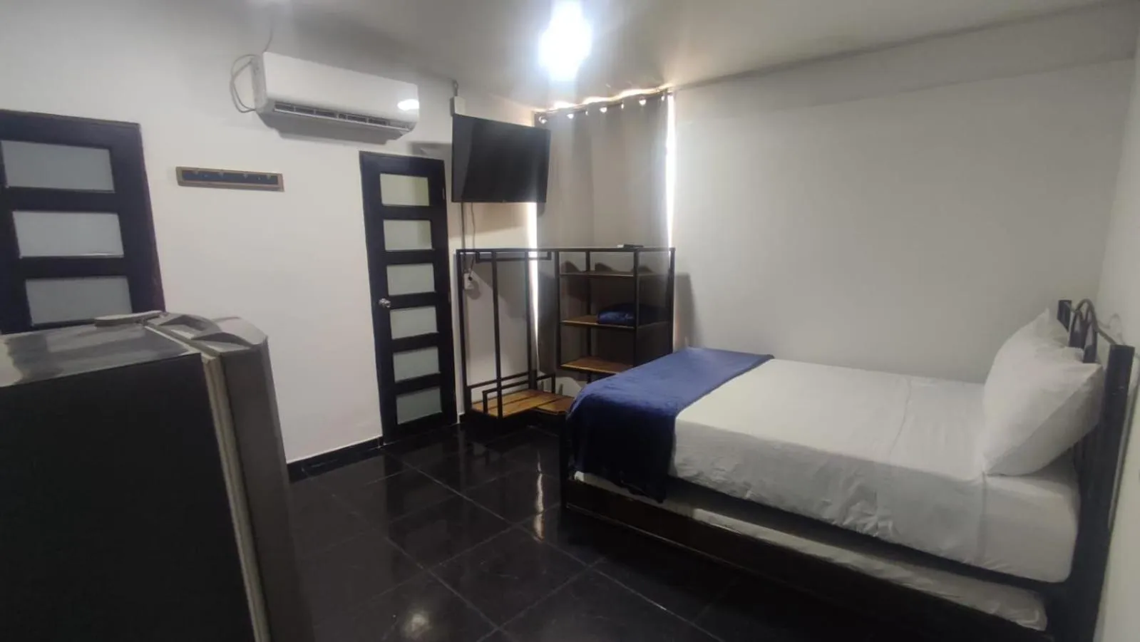 Kitchen or kitchenette, Bed in Hotel Family House Rodadero