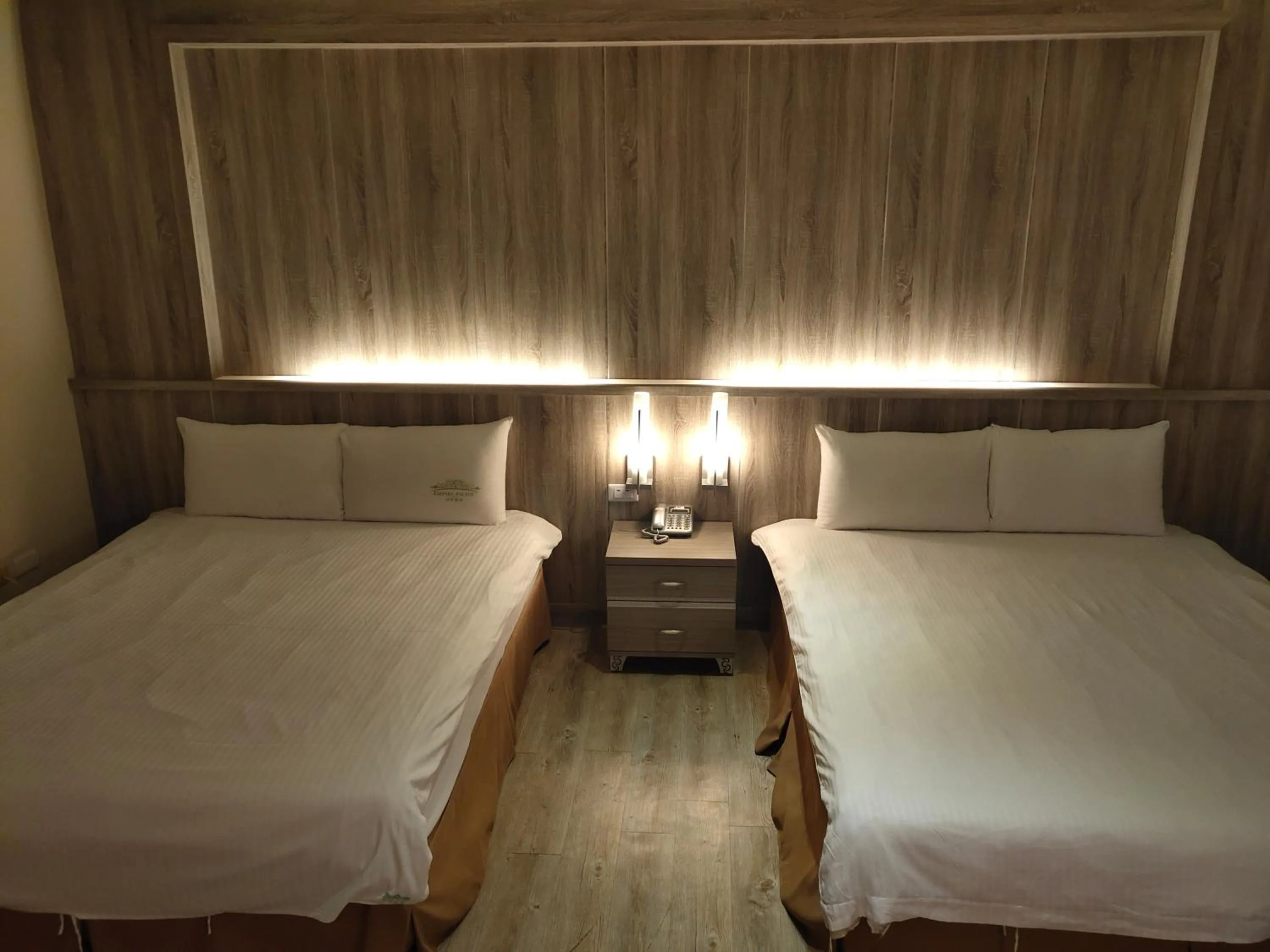 Bed in Empire Pacific Hotel龍潭科學園區 六福村 幼獅工業園區 長租旅居