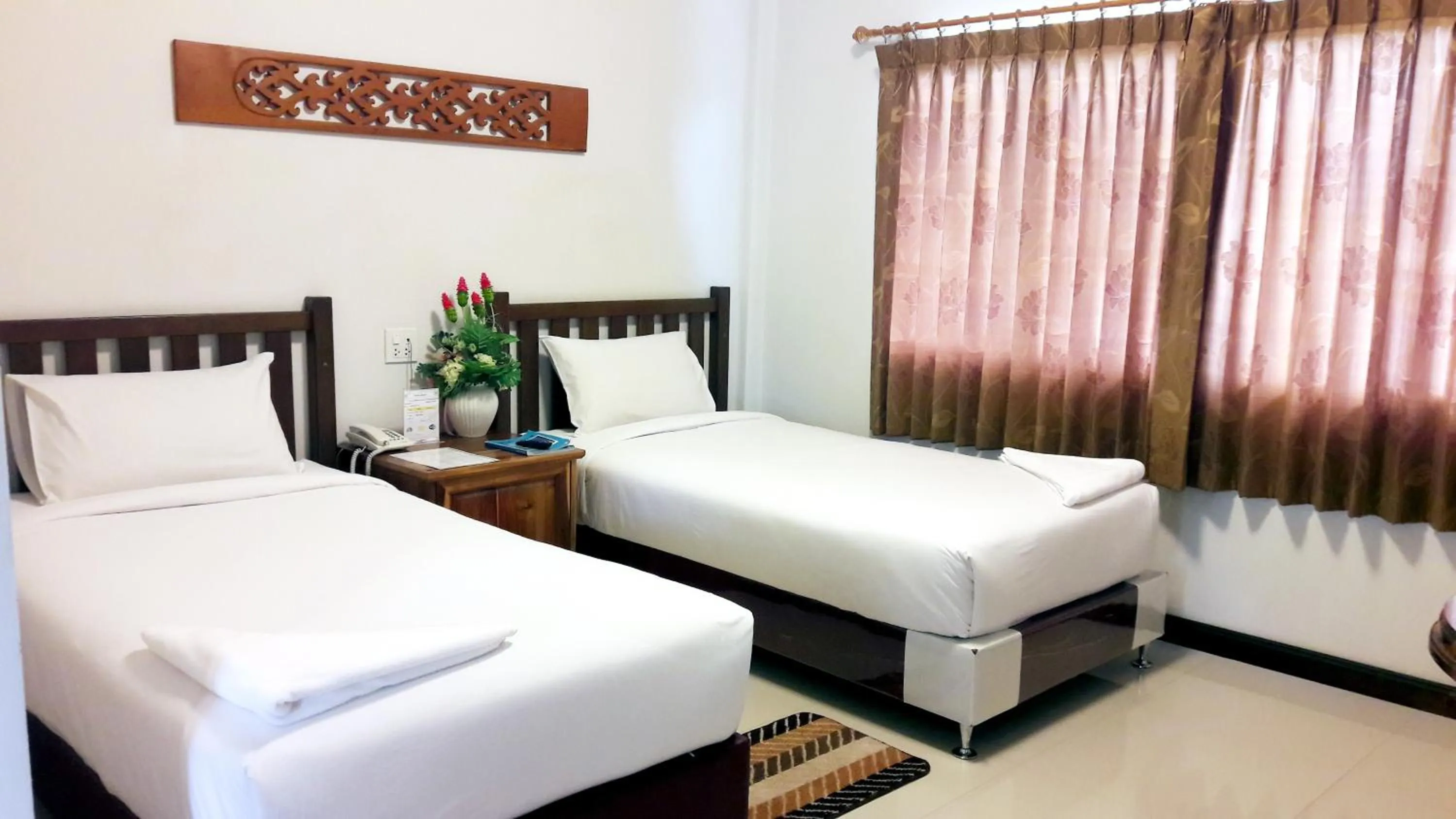 Bed in Khum Nakhon Hotel