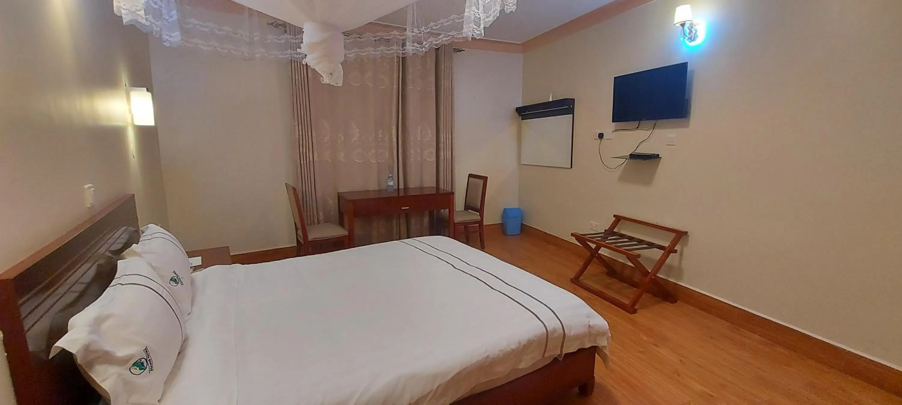 Communal lounge/ TV room, Bed in Asamar Country Resort