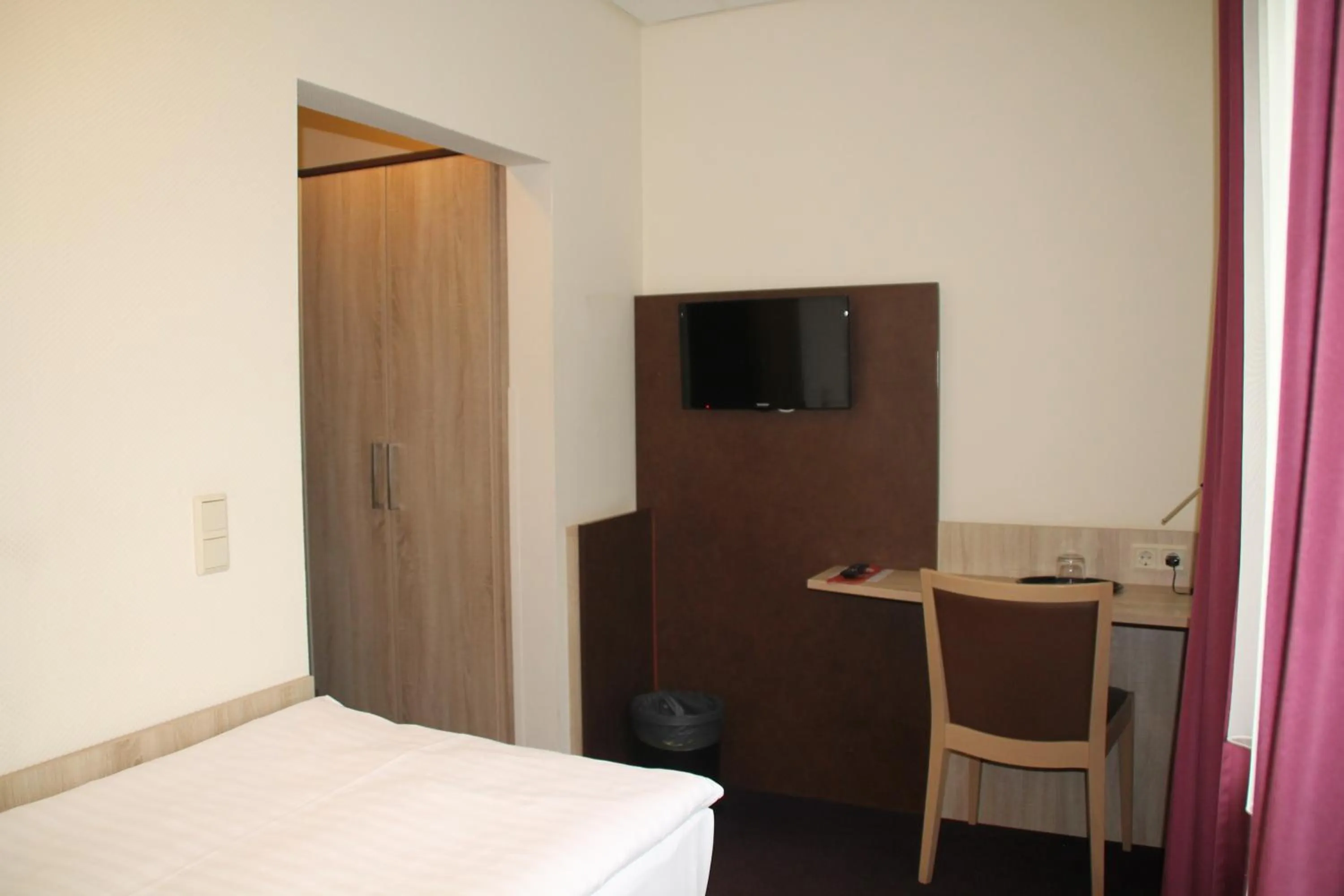 Bed in Hotel Stadt Kamen