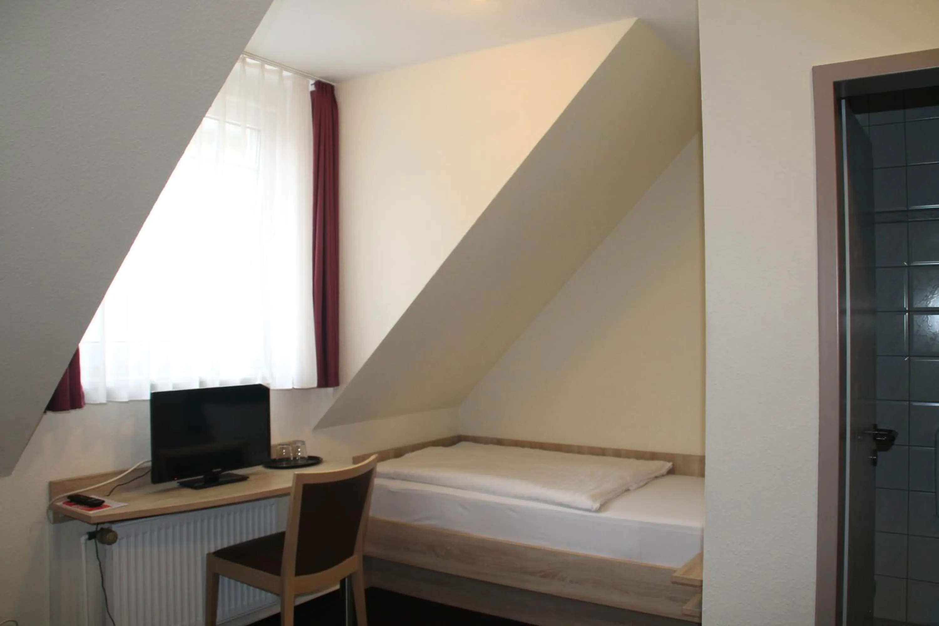 Bed in Hotel Stadt Kamen