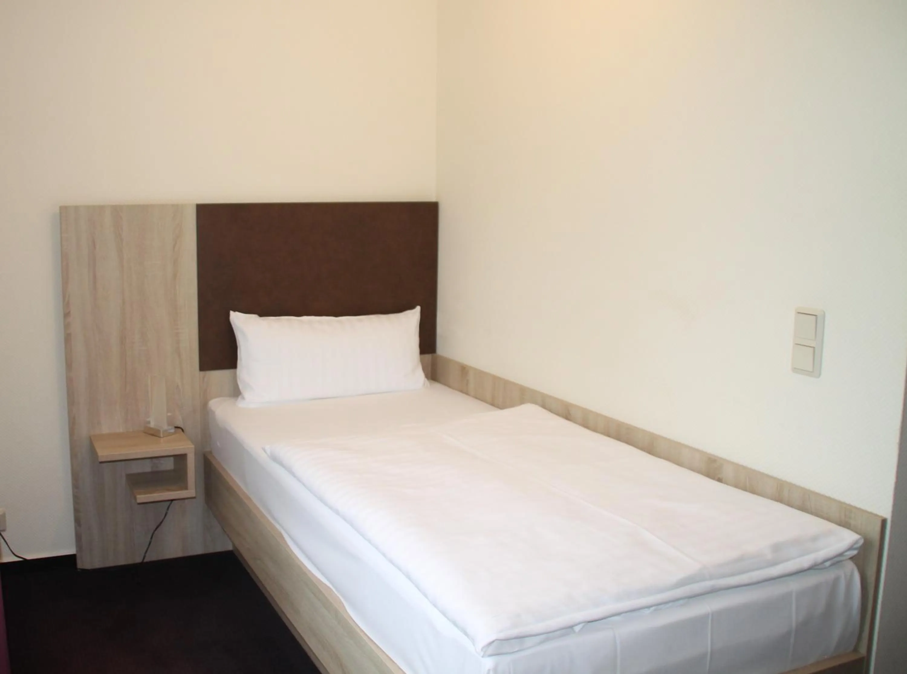 Bed in Hotel Stadt Kamen