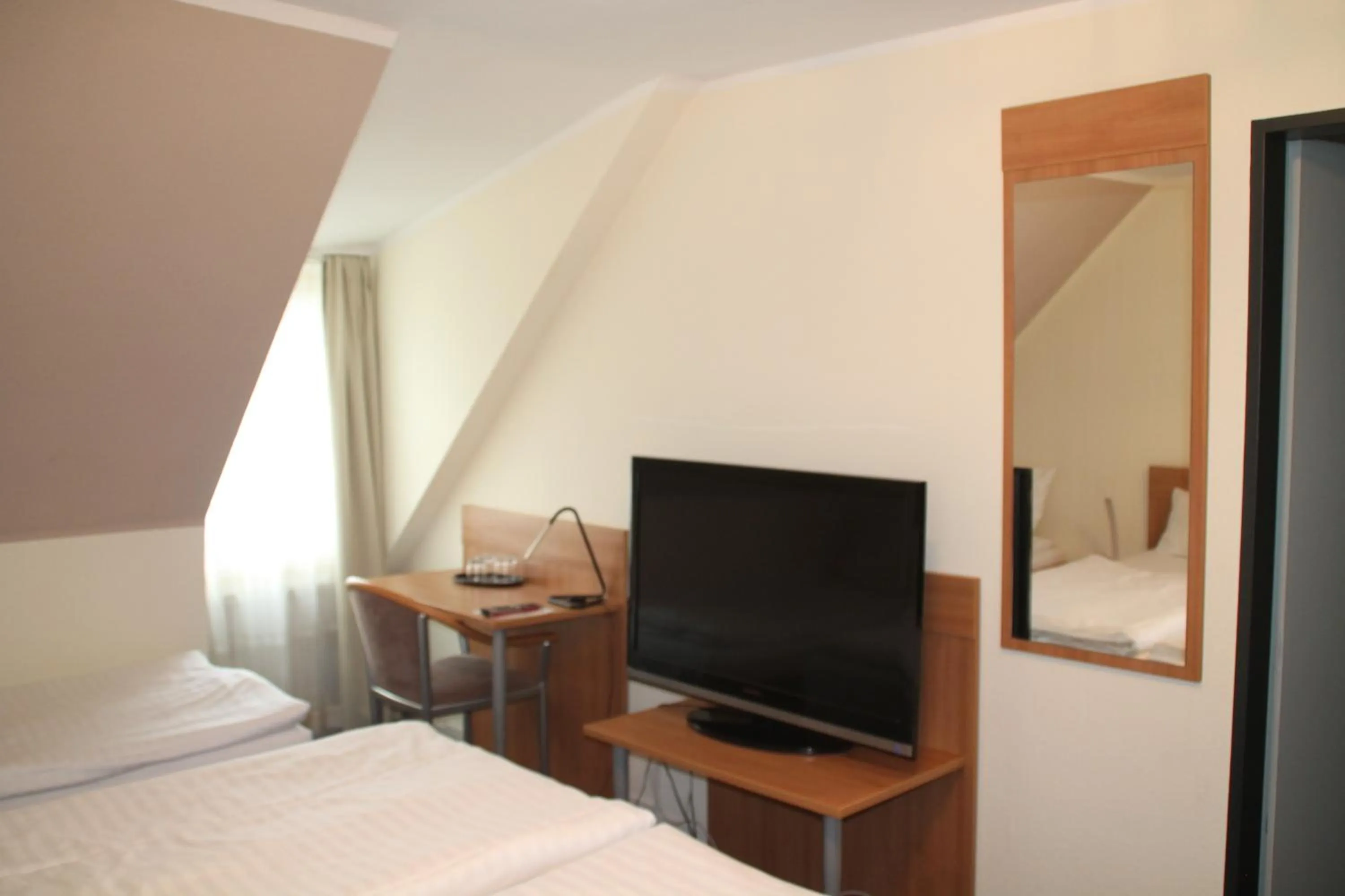 Bed in Hotel Stadt Kamen