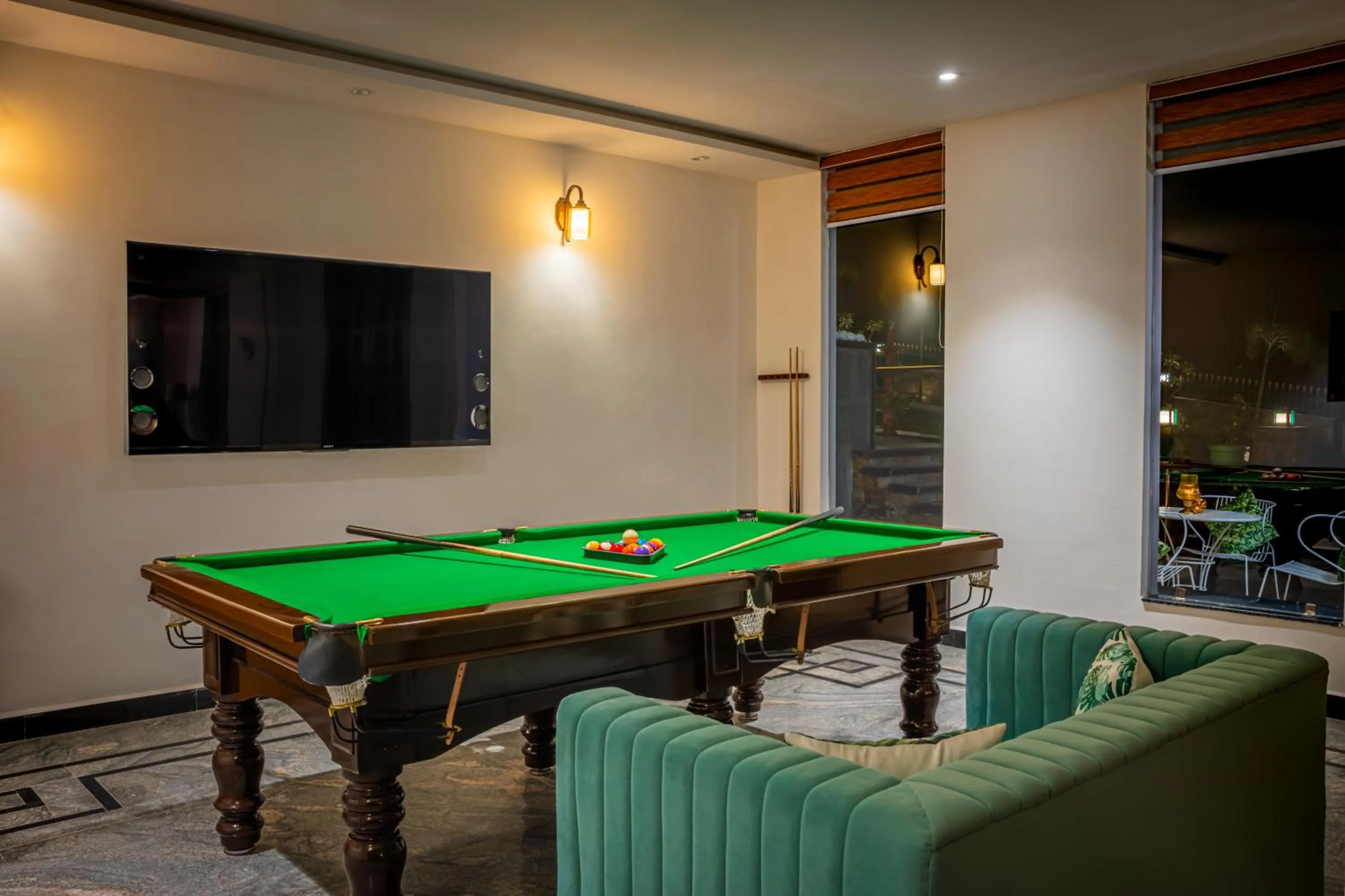 Communal lounge/ TV room in Tree of Life Vantara Resort & Spa