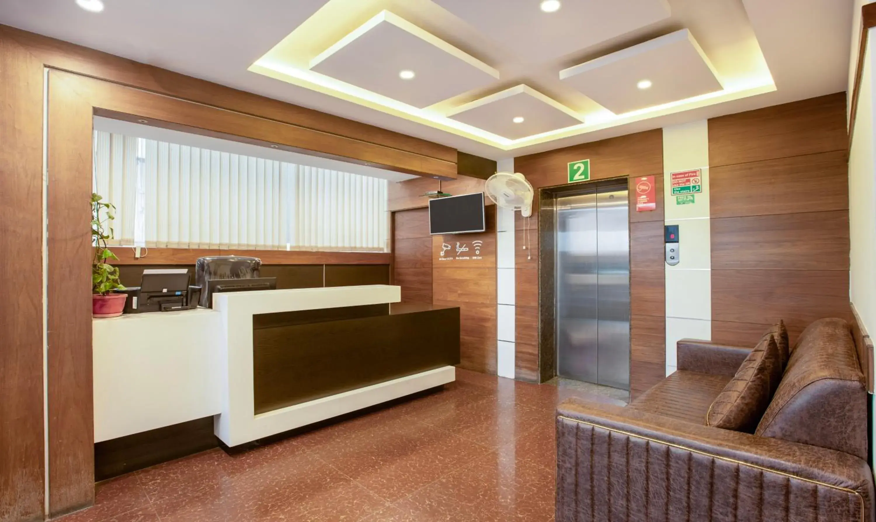 Lobby or reception in Treebo New Plus Point Lobby or reception in Treebo New Plus Point