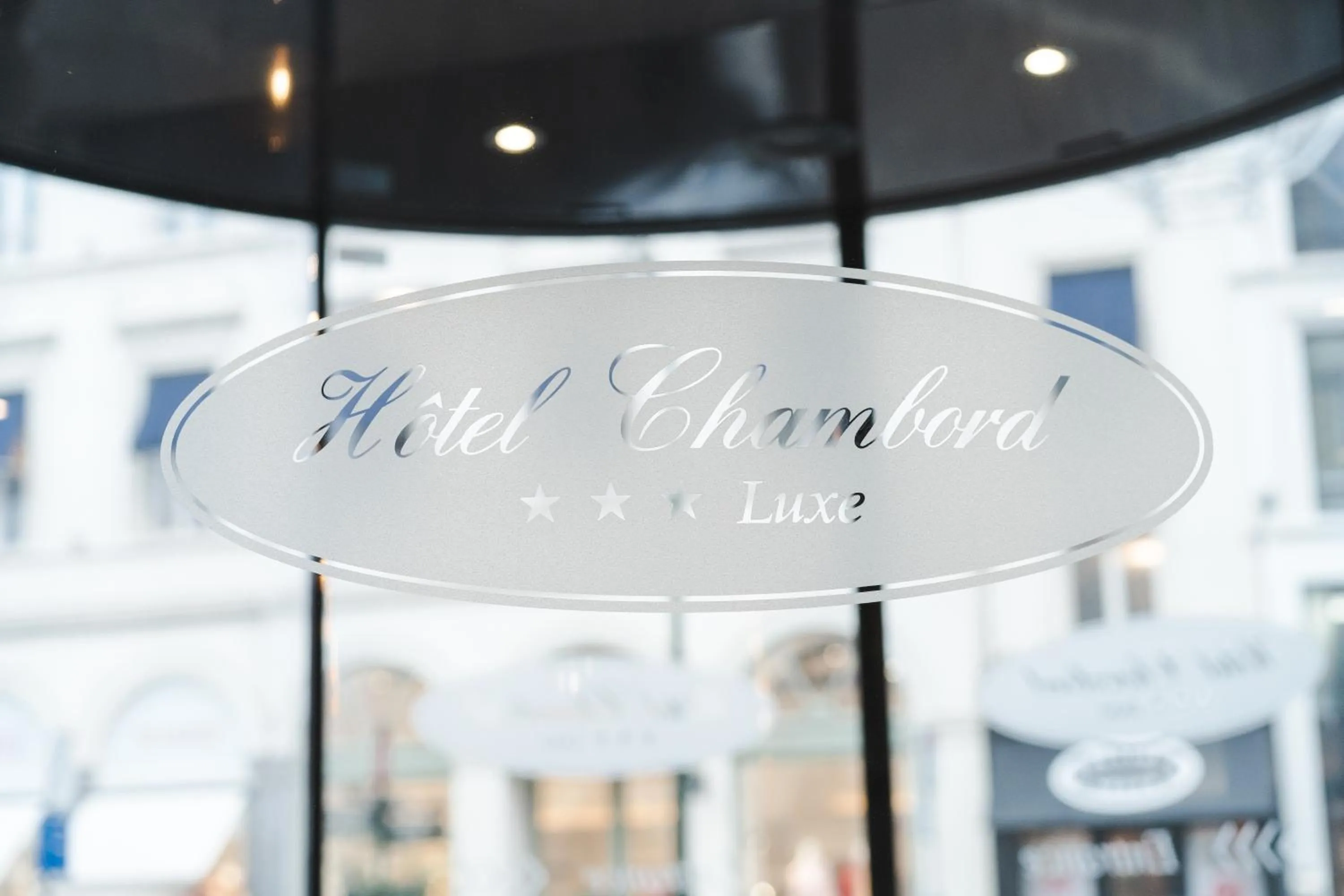 Property logo or sign in Hotel Chambord