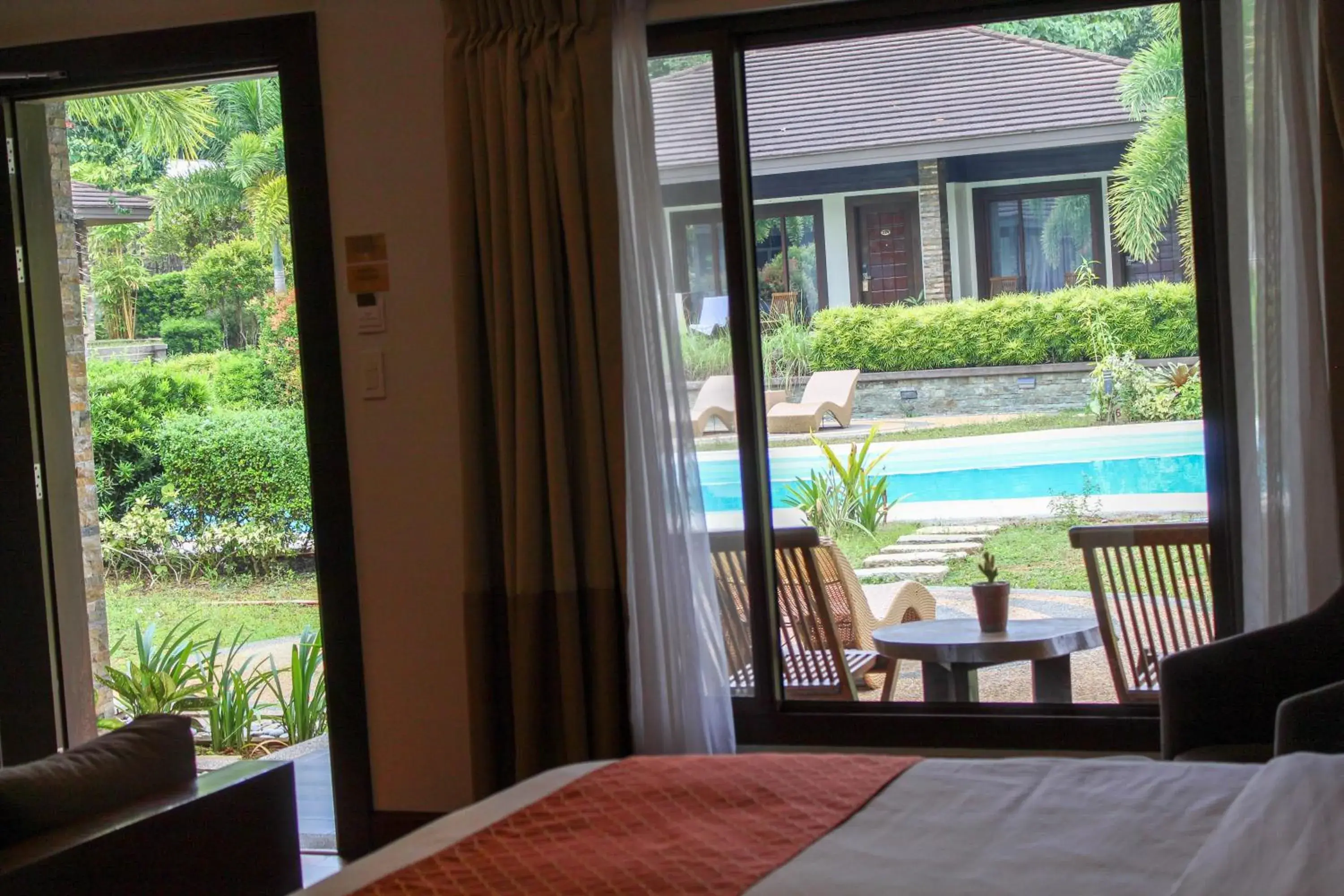 Pool view, Bed in Coron Soleil Garden Resort Pool view, Bed in Coron Soleil Garden Resort