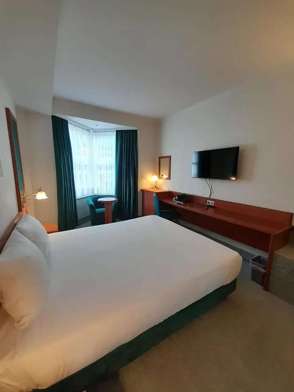 Communal lounge/ TV room, Bed in Hotel Le Dome Communal lounge/ TV room, Bed in Hotel Le Dome