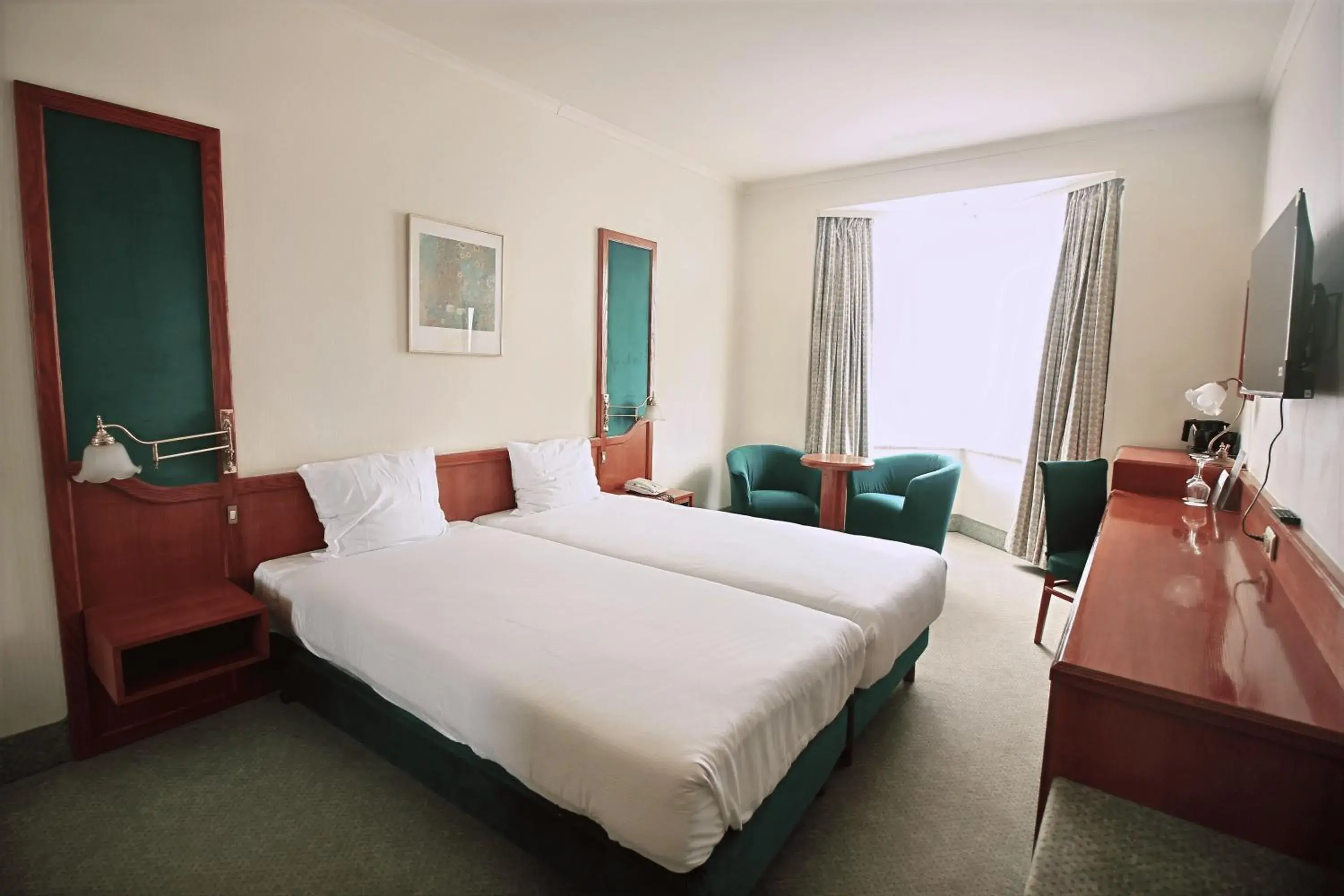 Communal lounge/ TV room, Bed in Hotel Le Dome Communal lounge/ TV room, Bed in Hotel Le Dome