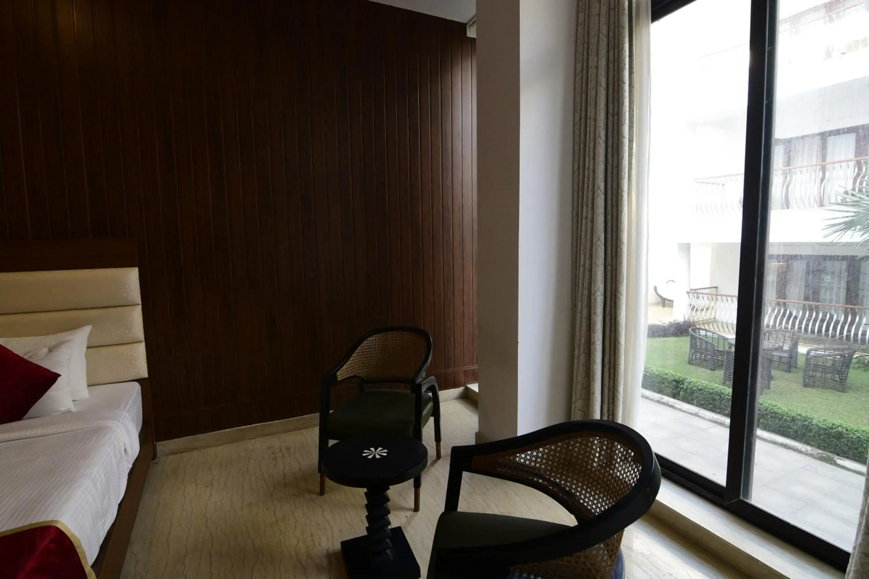 Seating area, Bed in Park Regis Goa Seating area, Bed in Park Regis Goa