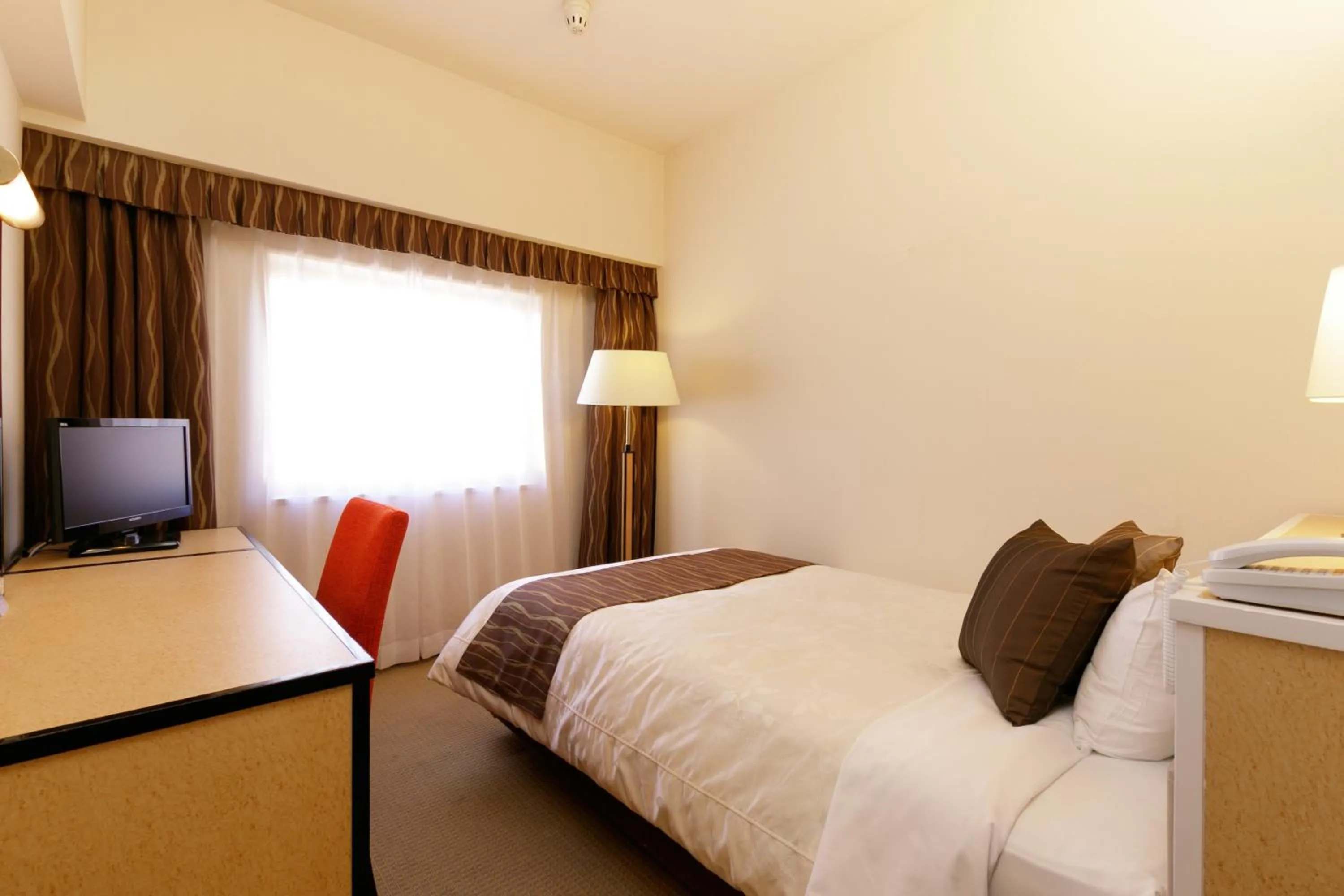 Photo of the whole room, Bed in The Celecton Fukushima