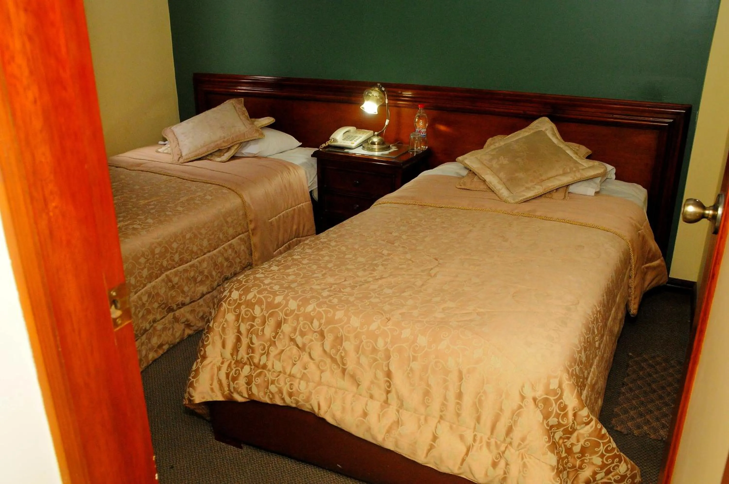 Bed in Colony Inn Hotel