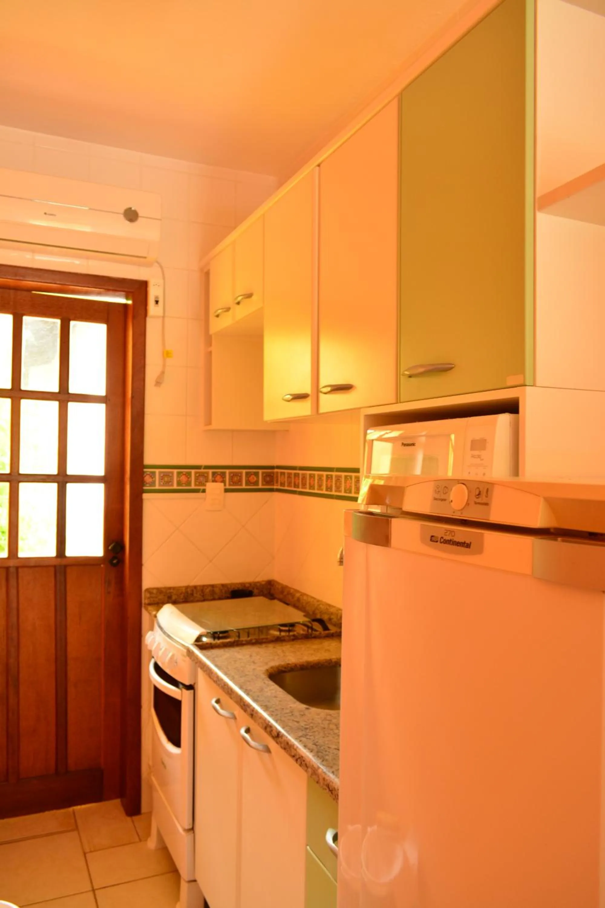Kitchen or kitchenette in Apartamentos Villa Porto do Sol