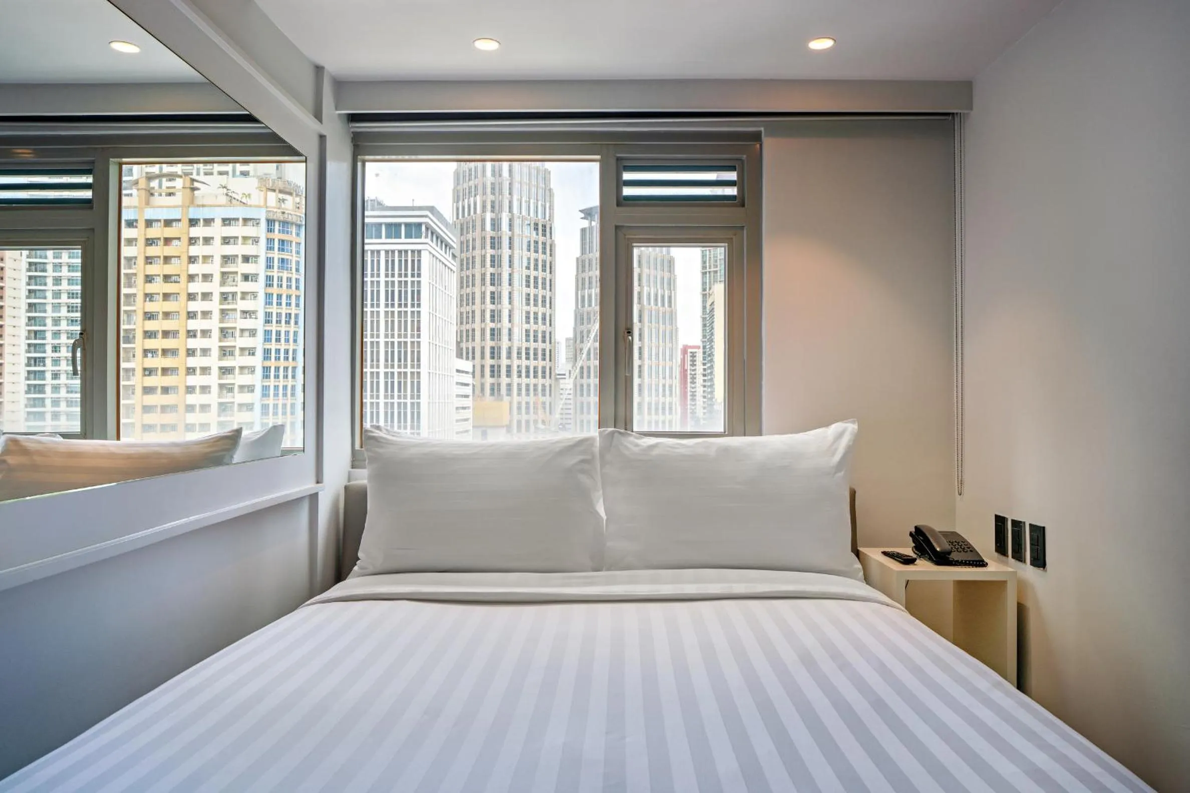 Bed in The Mini Suites Eton Tower Makati