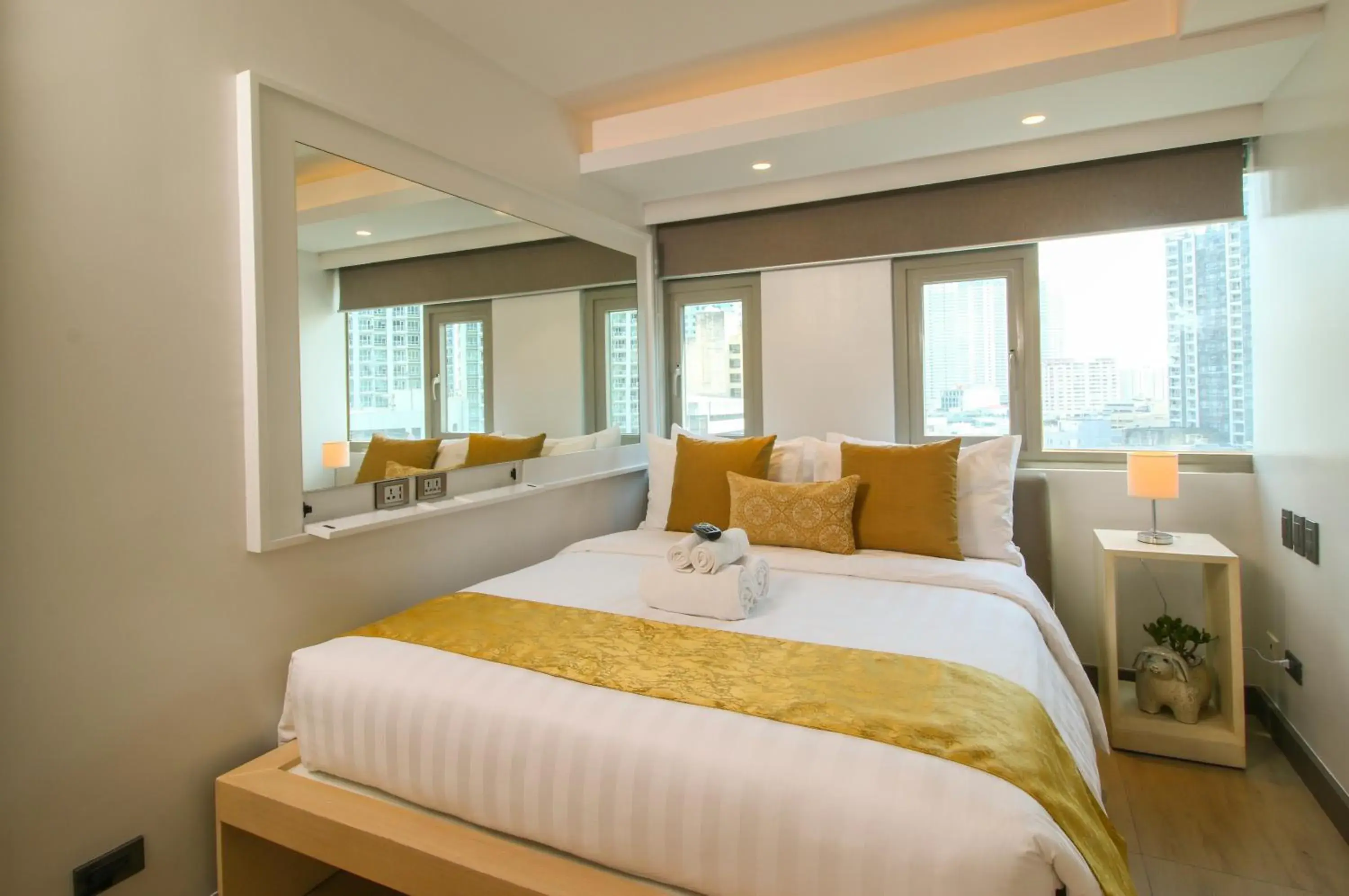 Bed in The Mini Suites Eton Tower Makati Bed in The Mini Suites Eton Tower Makati