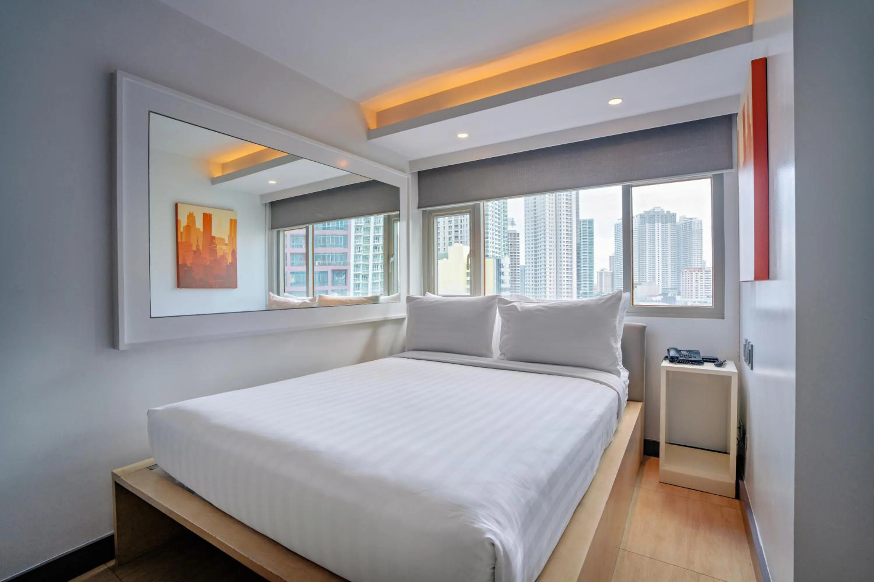 Bed in The Mini Suites Eton Tower Makati
