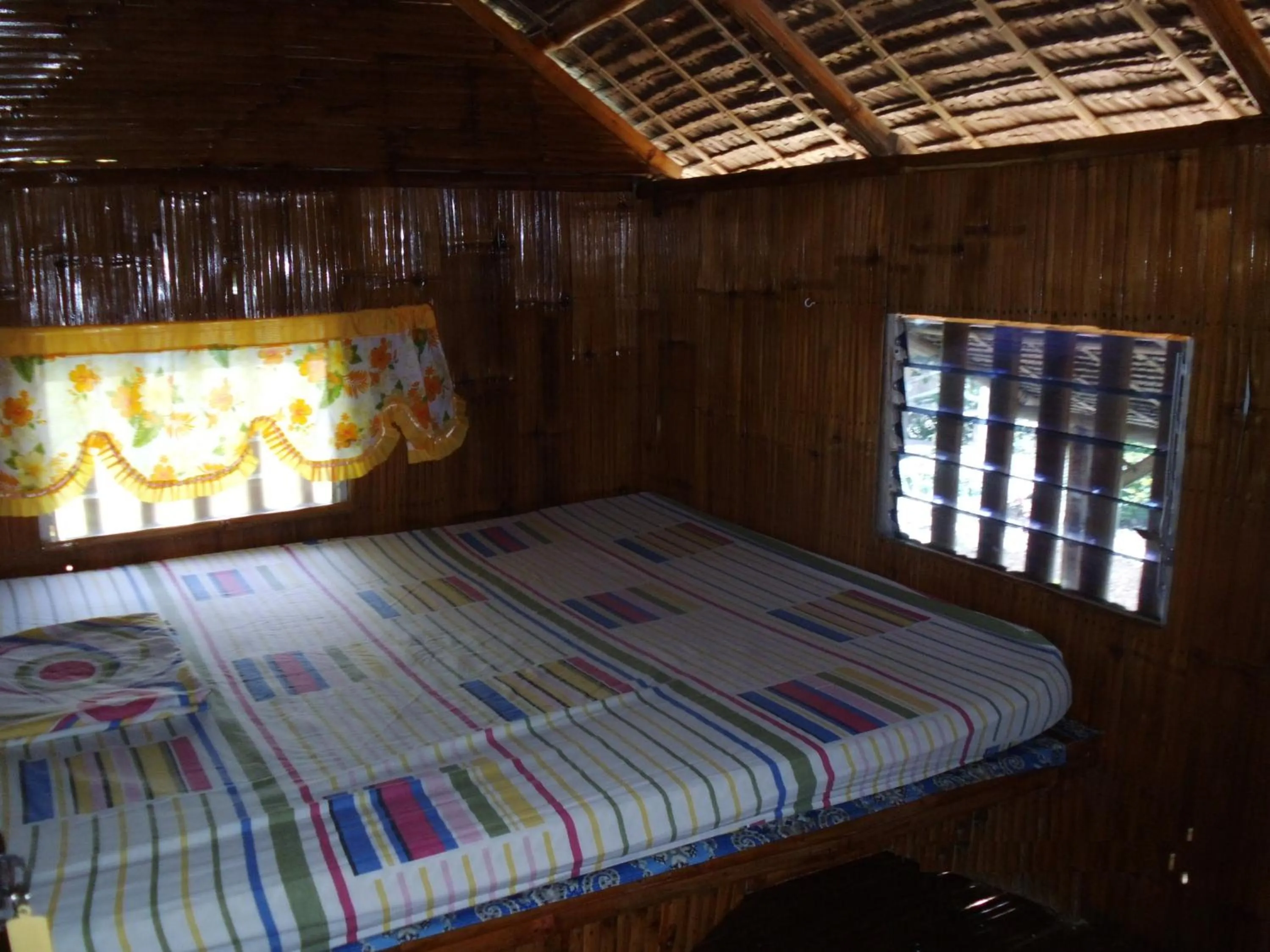 Bed in Moalboal Bamboo Guest House