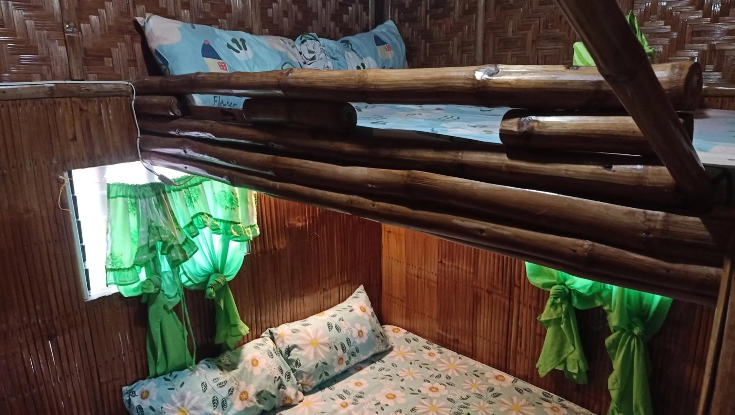 Bed in Moalboal Bamboo Guest House