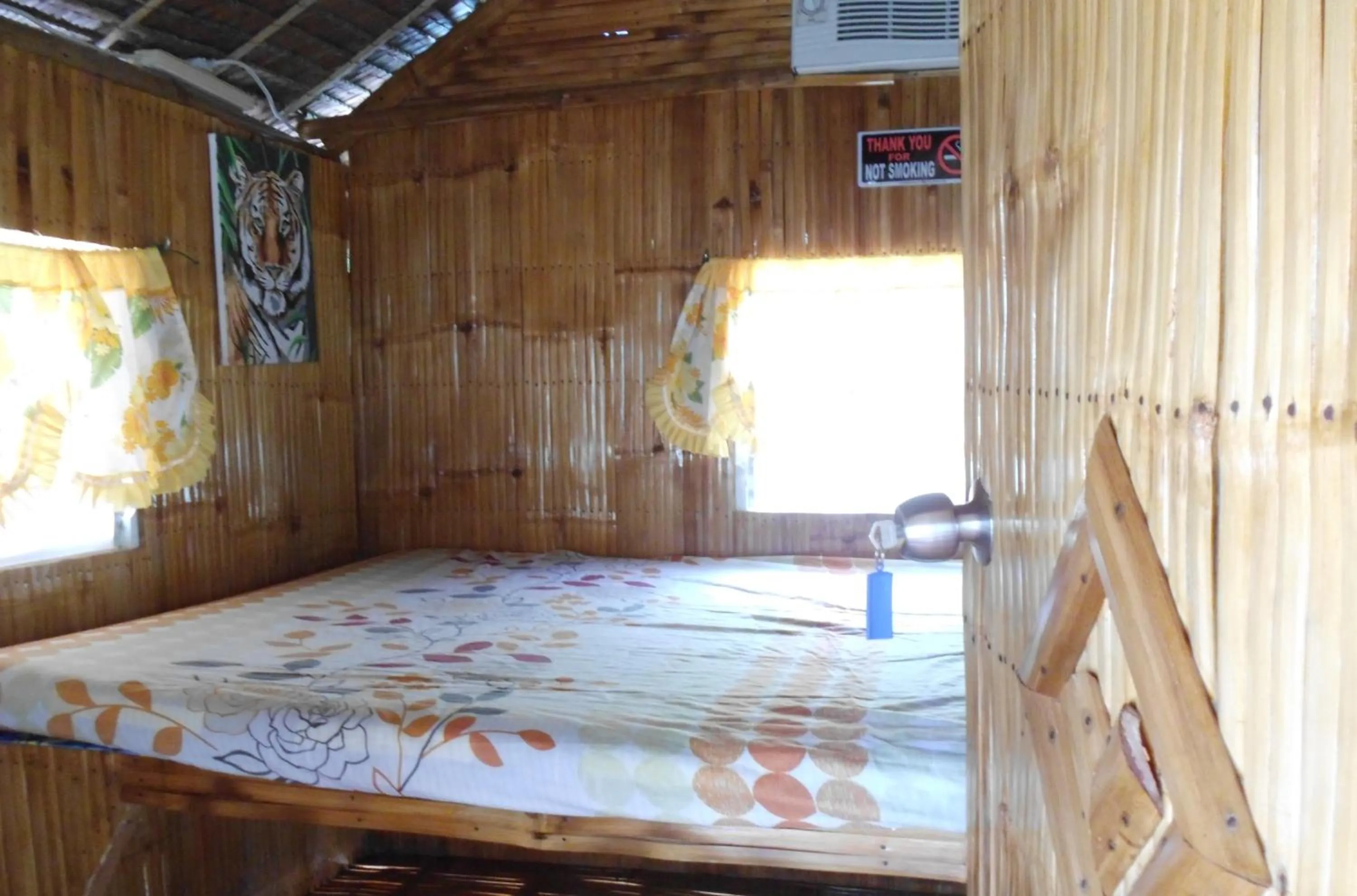 Bed in Moalboal Bamboo Guest House