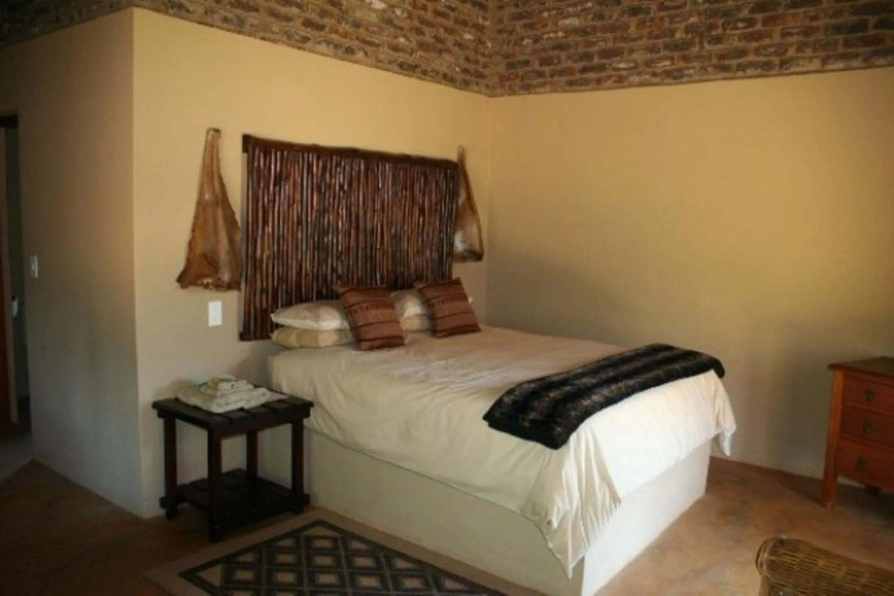 Bed in African Flair Country Lodge