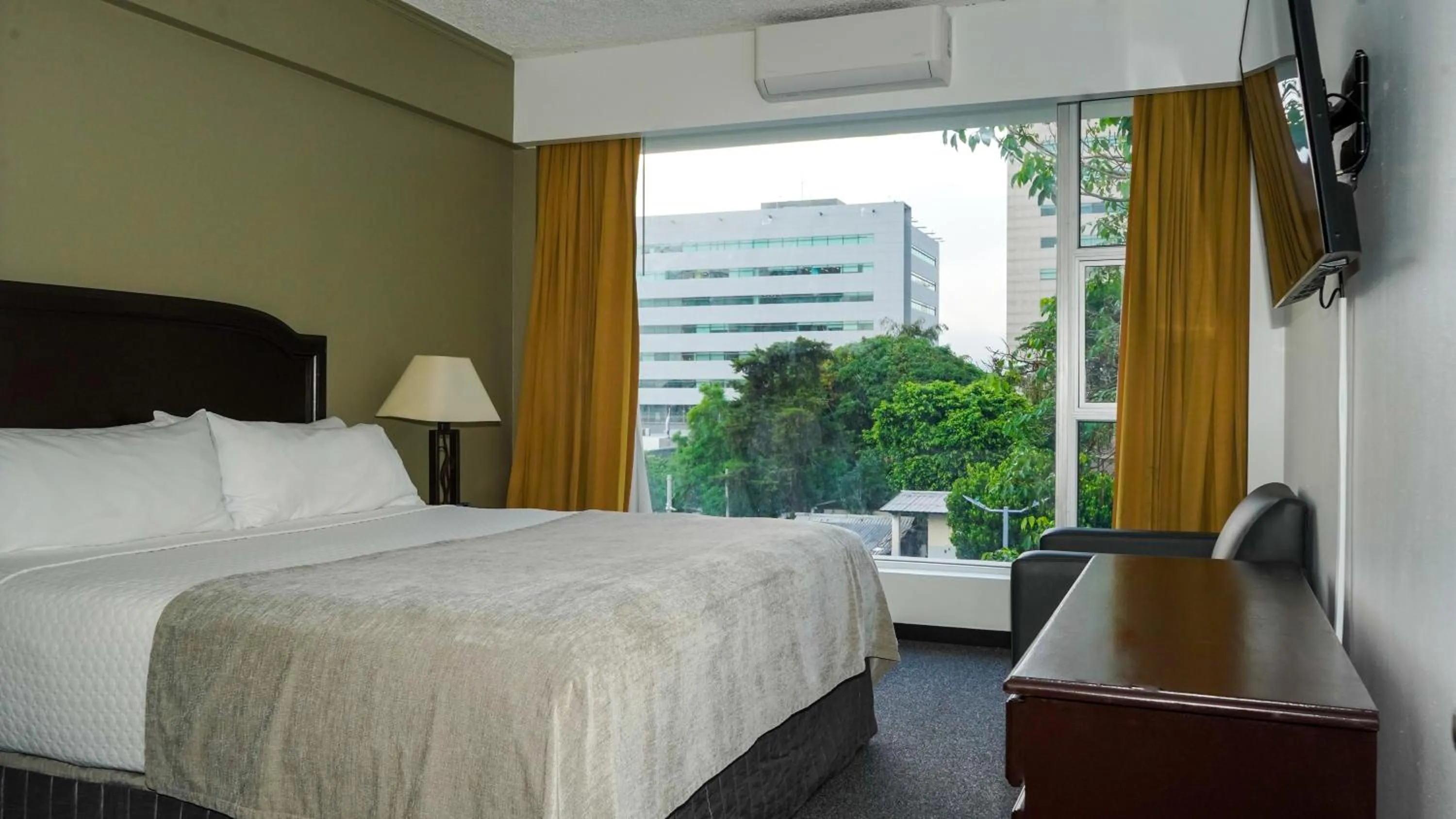 Bed in Plaza Hotel and Suites