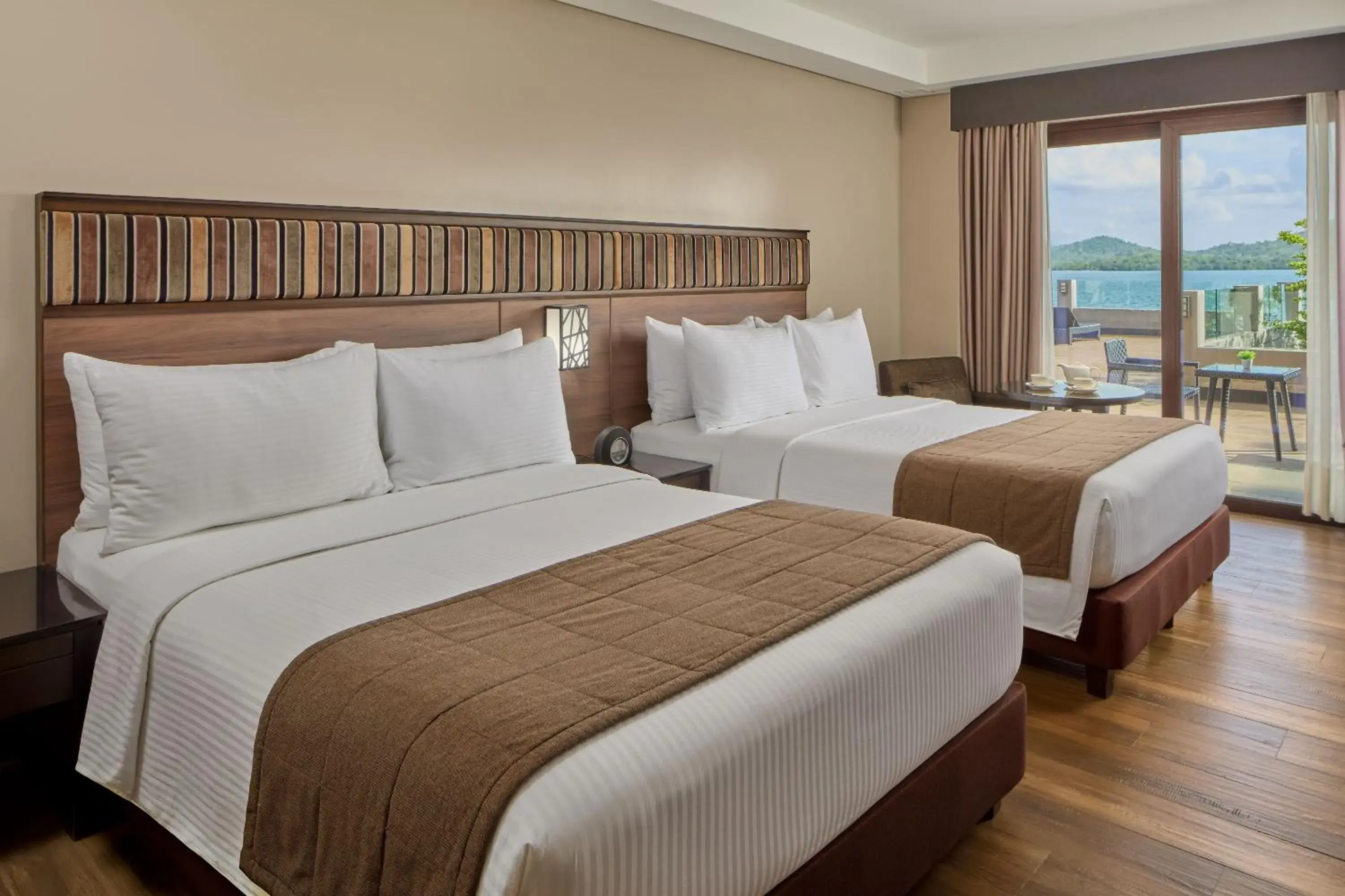 Bed in Two Seasons Coron Bayside Hotel Bed in Two Seasons Coron Bayside Hotel