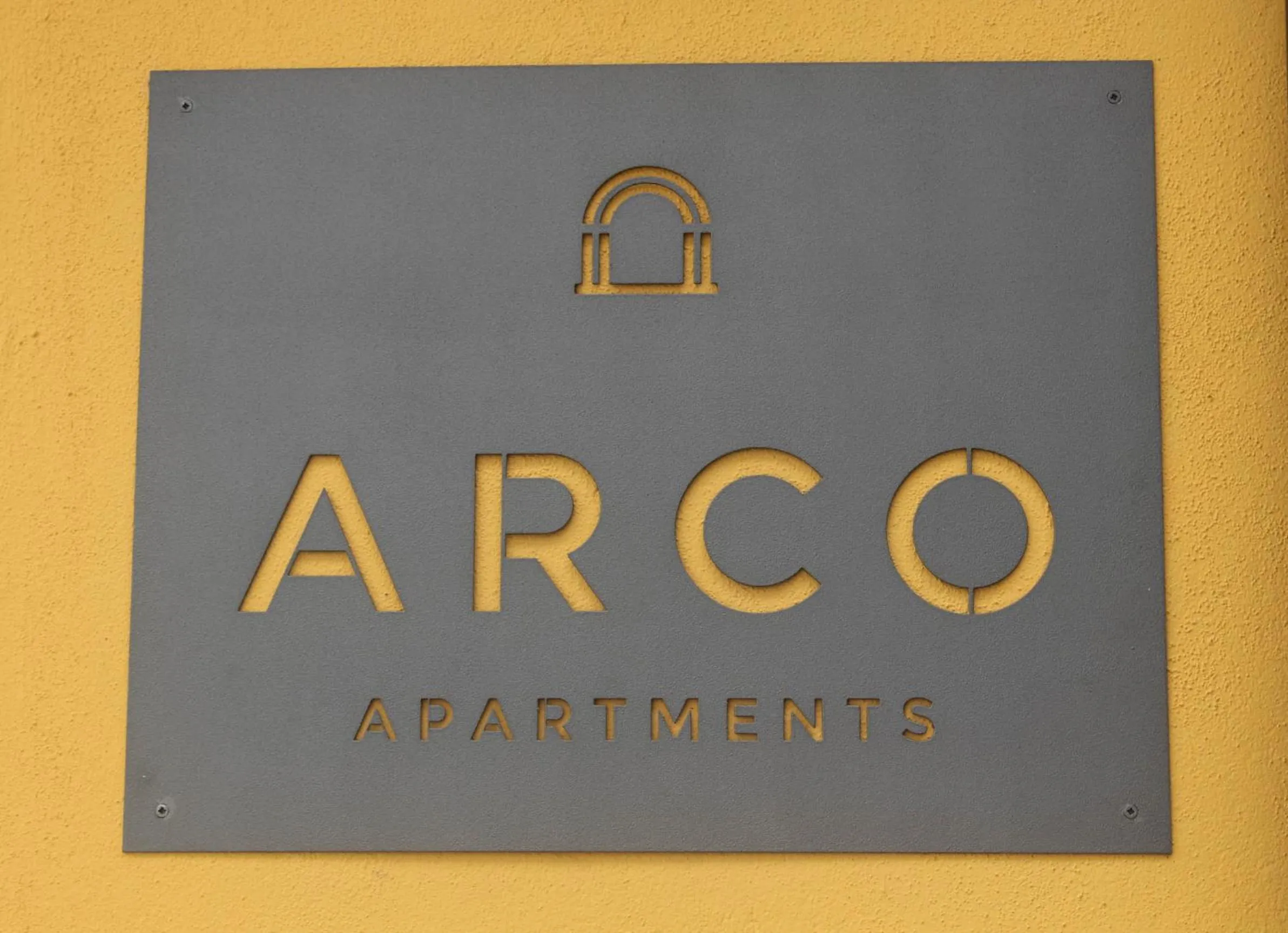 Property logo or sign in Arco Apartments
