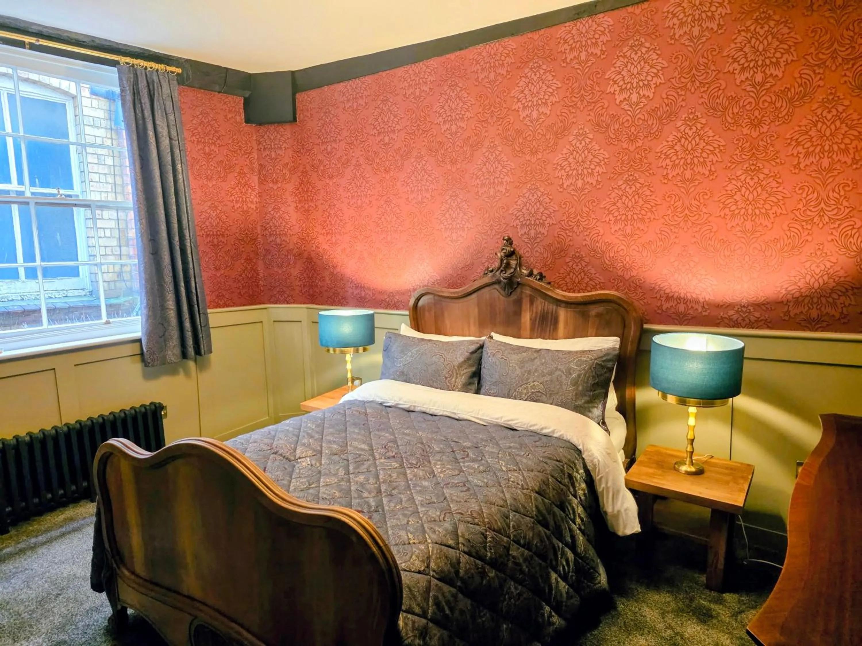 Bed in The New Inn by Roomsbooked