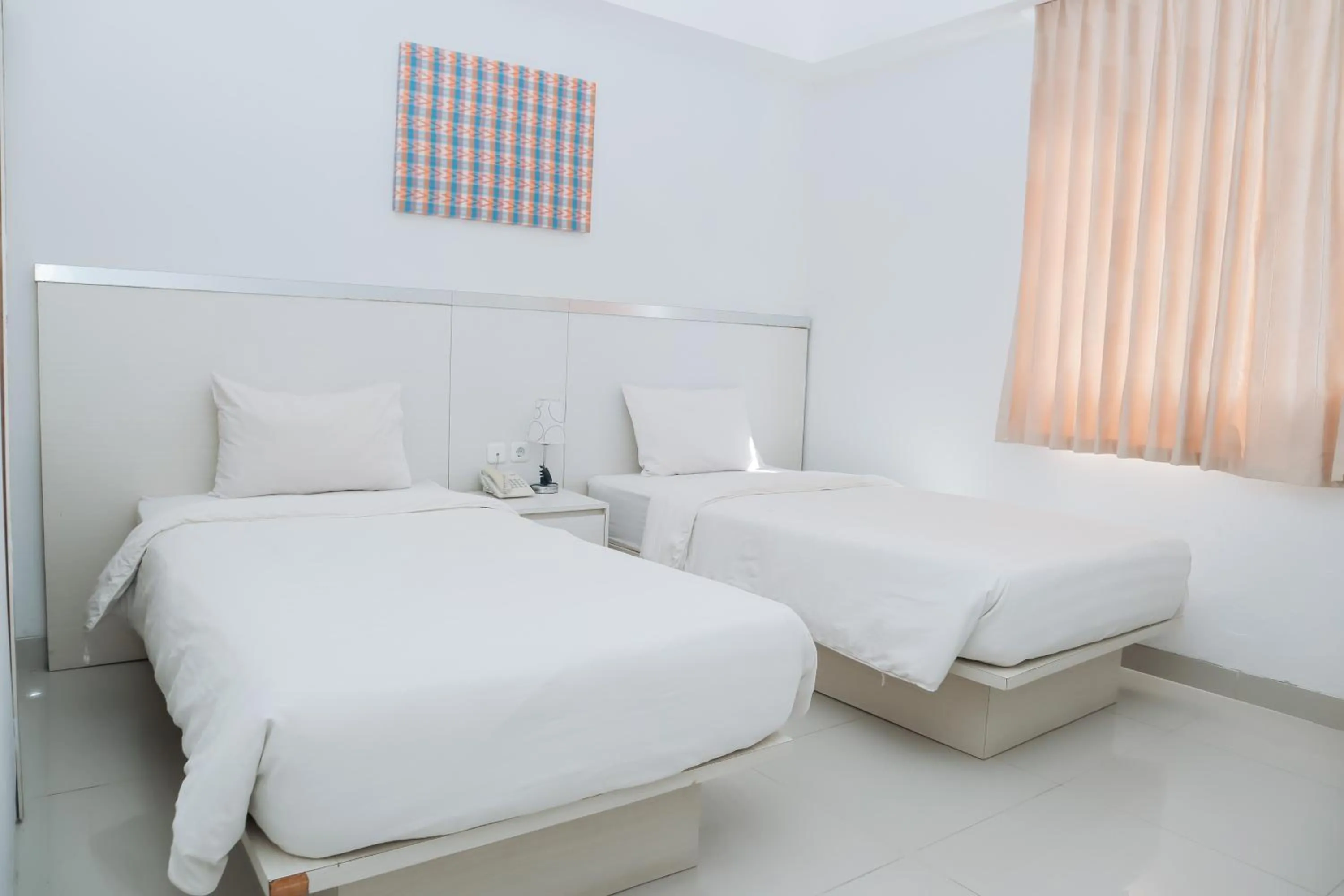 Bed in Liberta Hotel Grand Sayang Makassar