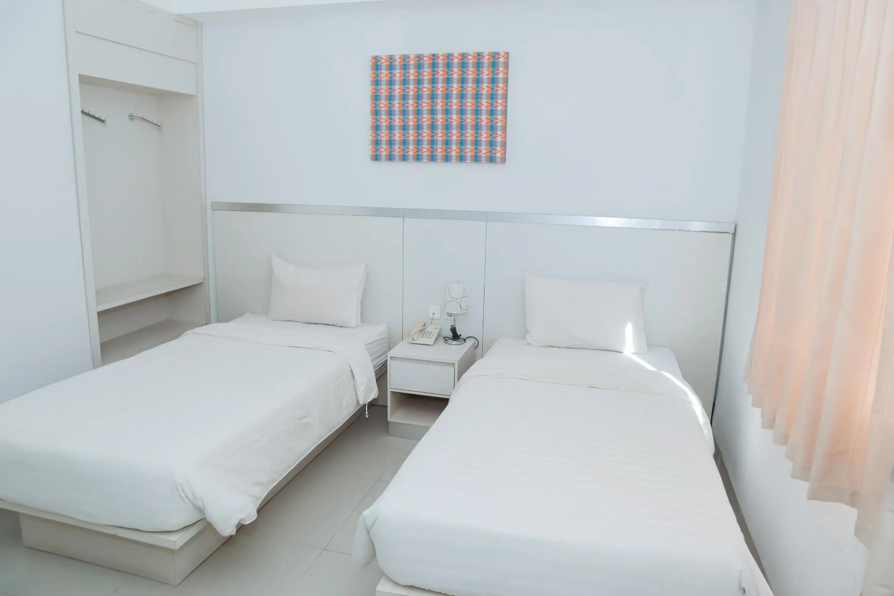 Bed in Liberta Hotel Grand Sayang Makassar