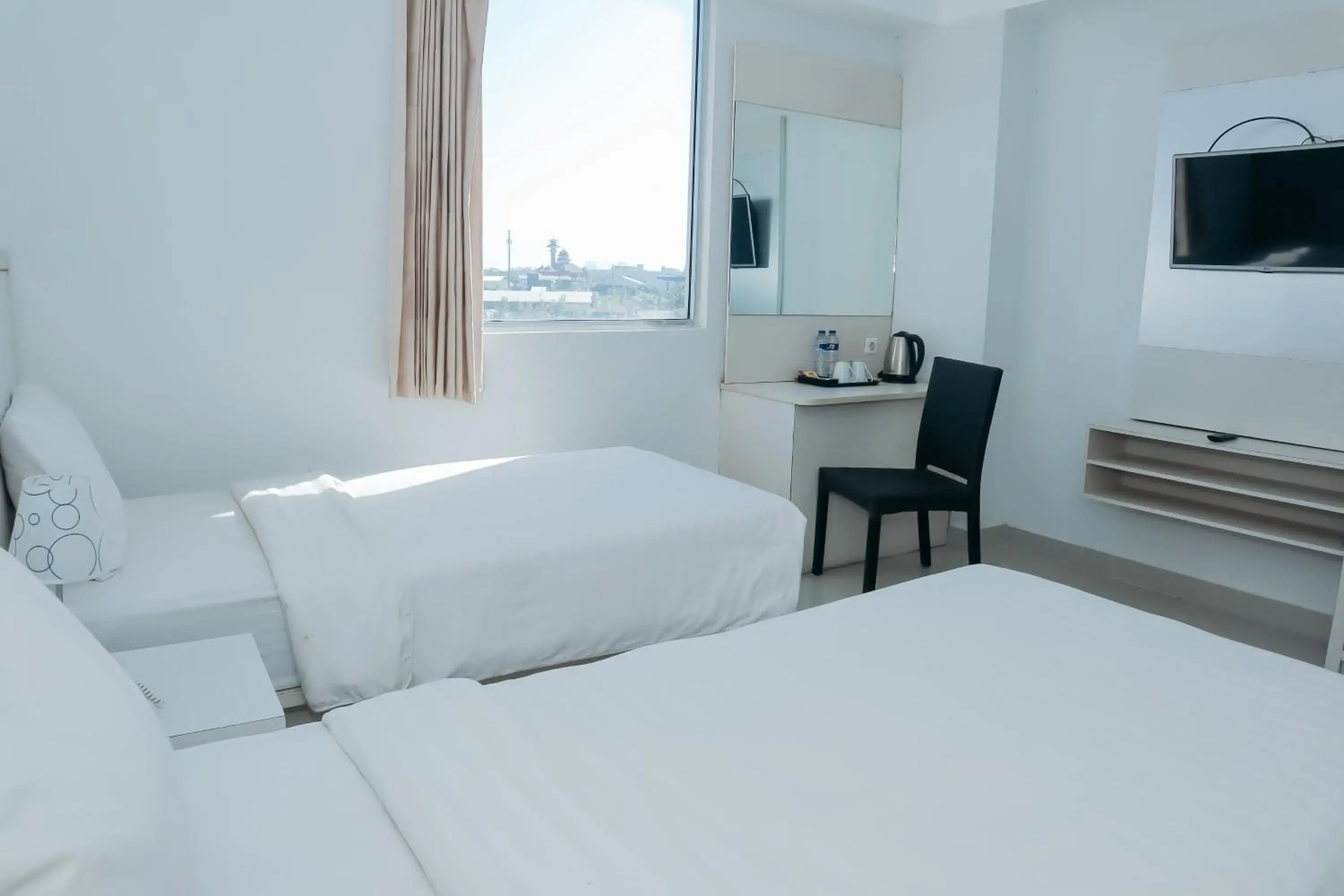 View (from property/room), Bed in Liberta Hotel Grand Sayang Makassar View (from property/room), Bed in Liberta Hotel Grand Sayang Makassar