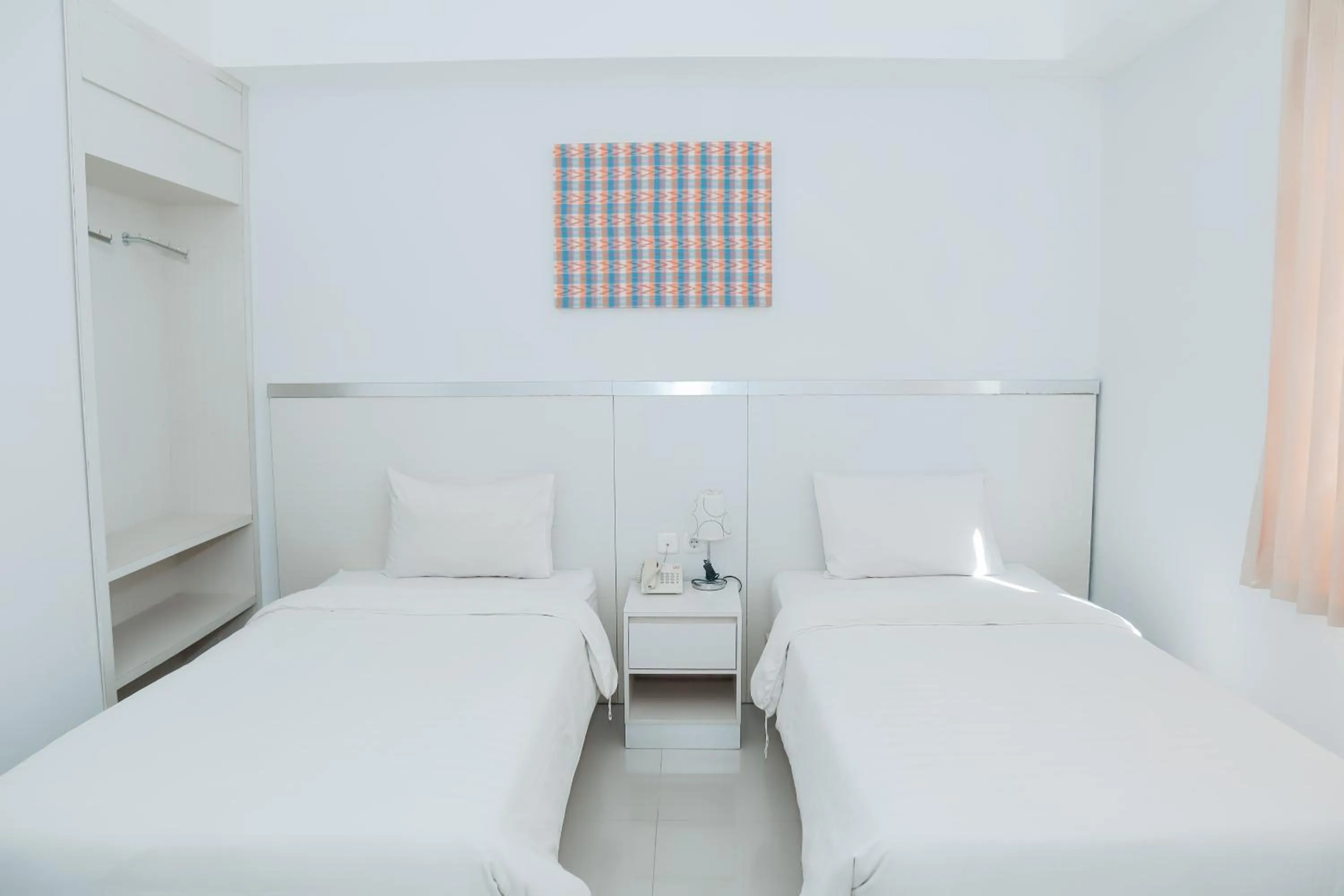 Bed in Liberta Hotel Grand Sayang Makassar