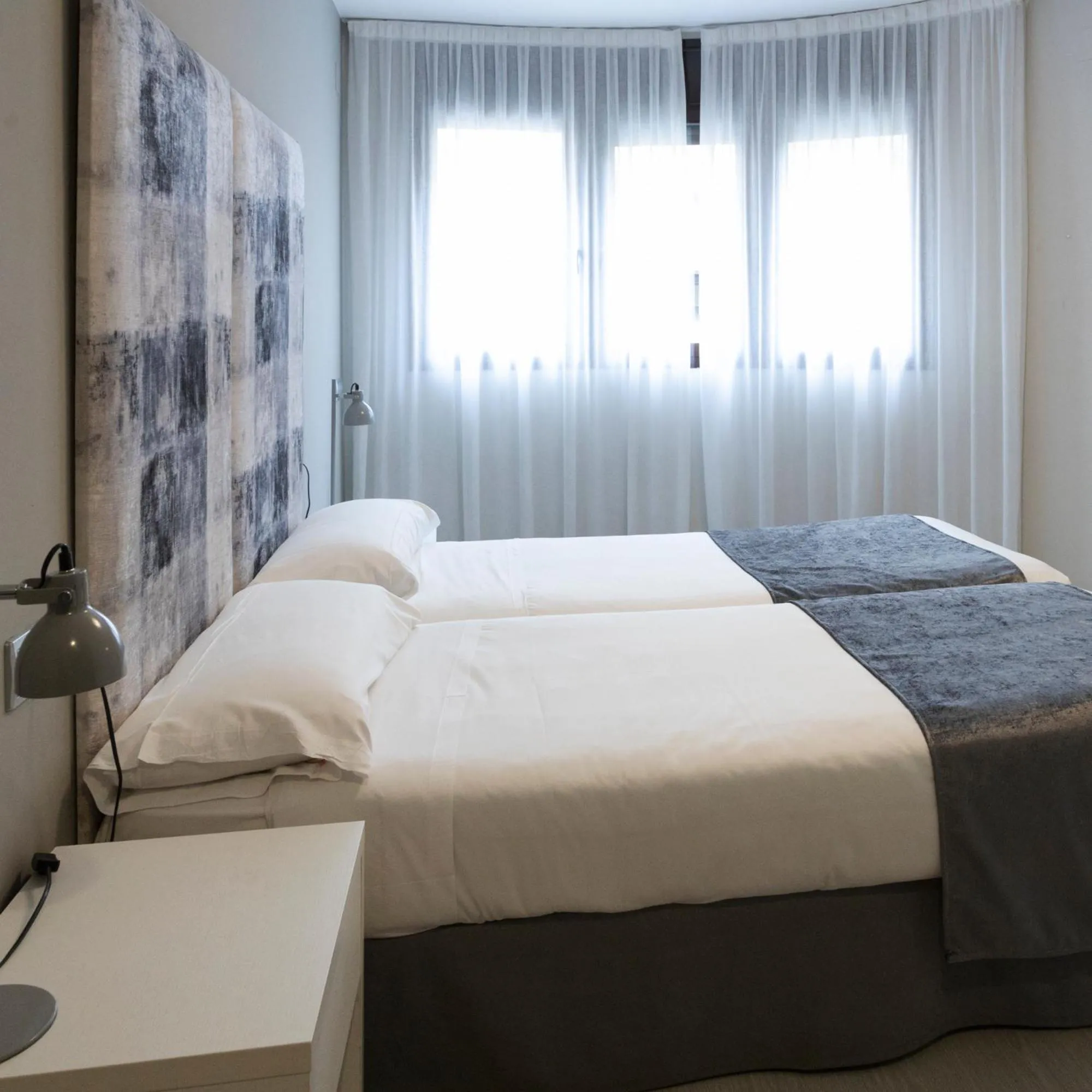 Bed in Apartamentos Real Lleida