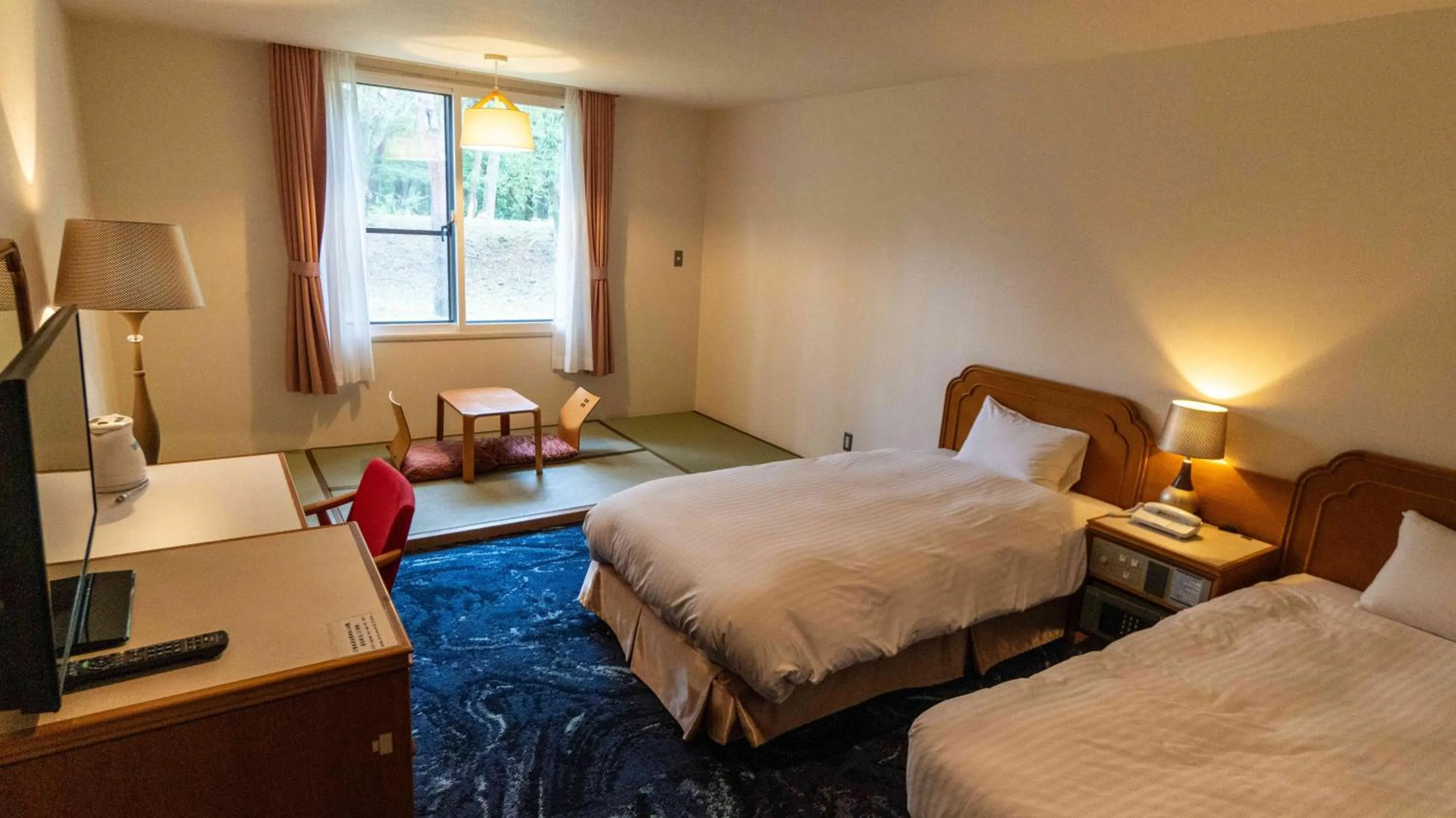 Bed in Motosu Phoenix Hotel