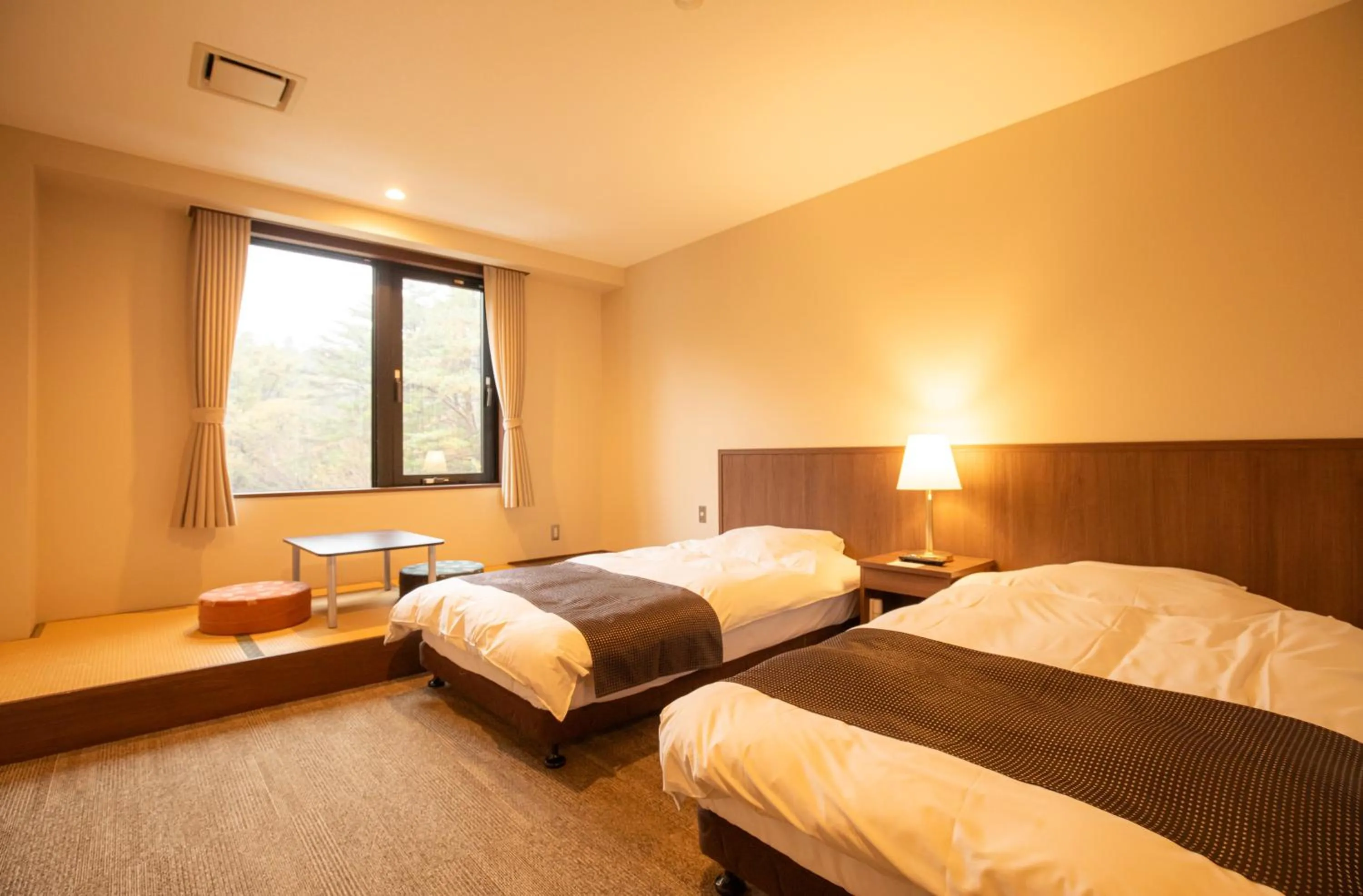 Bed in Motosu Phoenix Hotel