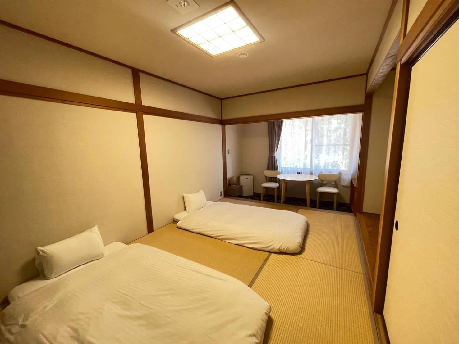 Bed in Motosu Phoenix Hotel