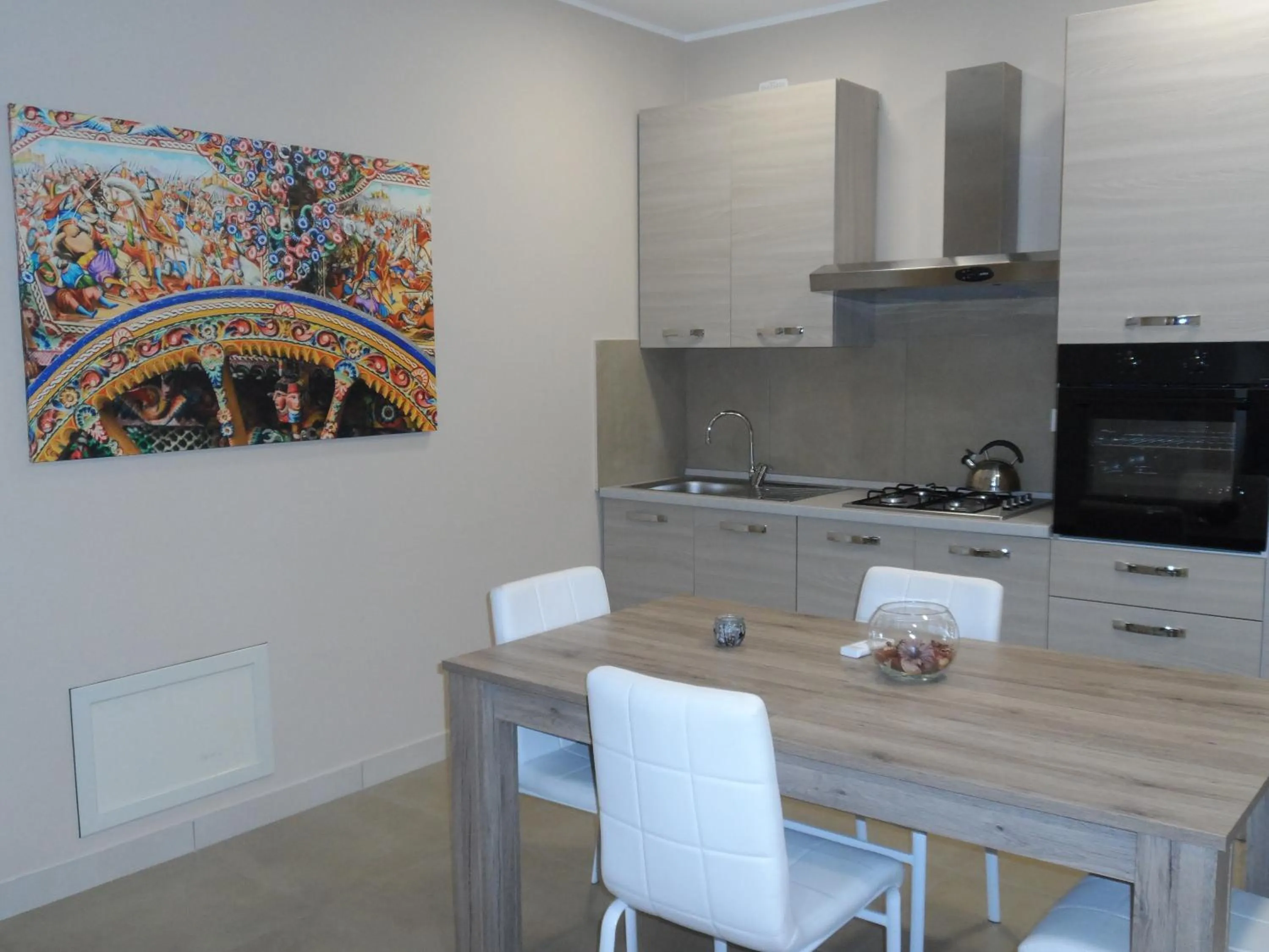 Kitchen or kitchenette in Residence Palazzo dei Delfini by RECEPTIO