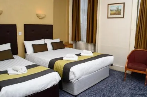 Bed in Rose Court Hotel