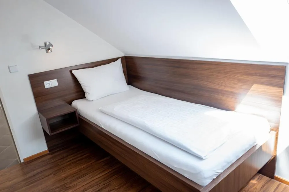 Bed in Garni Hotel Henn