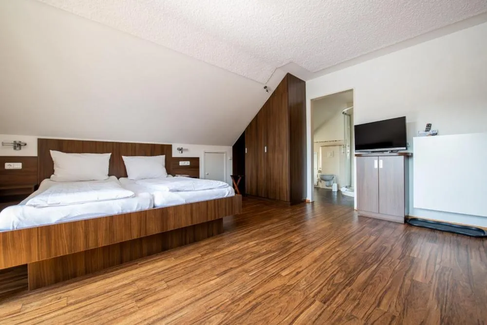 Bed in Garni Hotel Henn