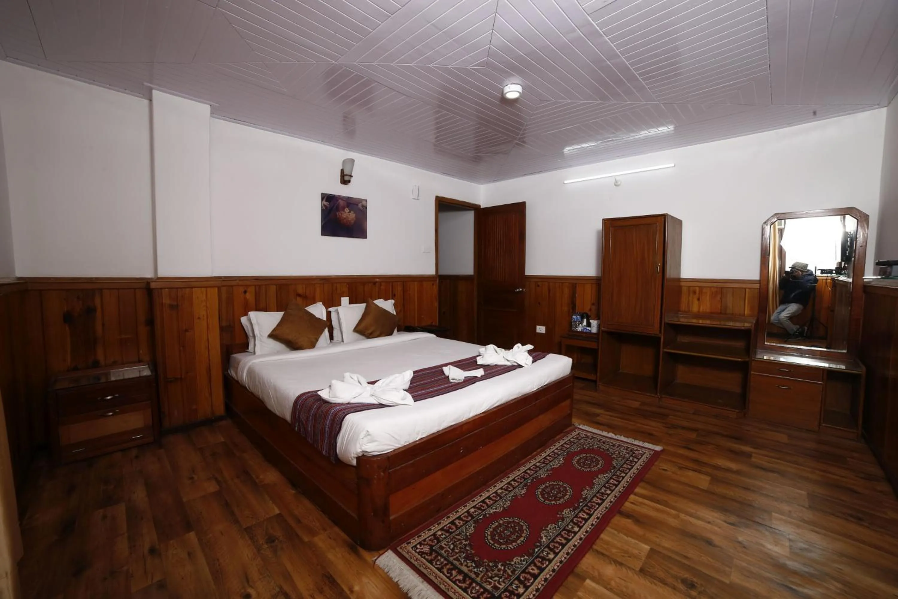 Bed in Yangthang Dzimkha Resort