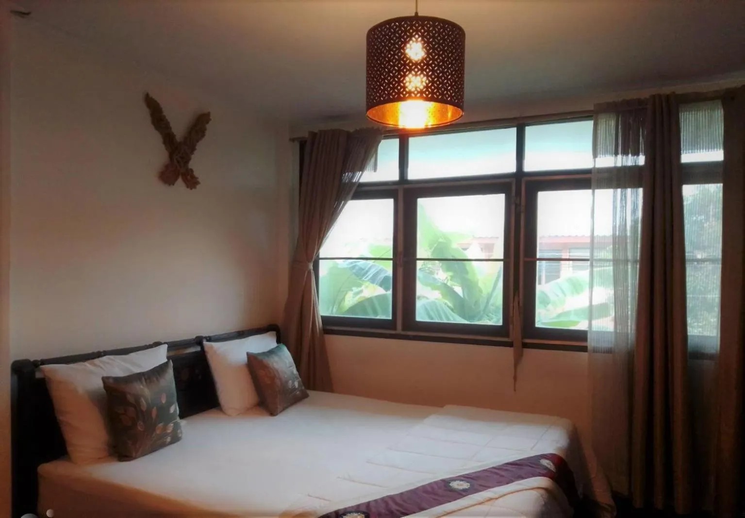 Bed in Naturbliss Resort Village